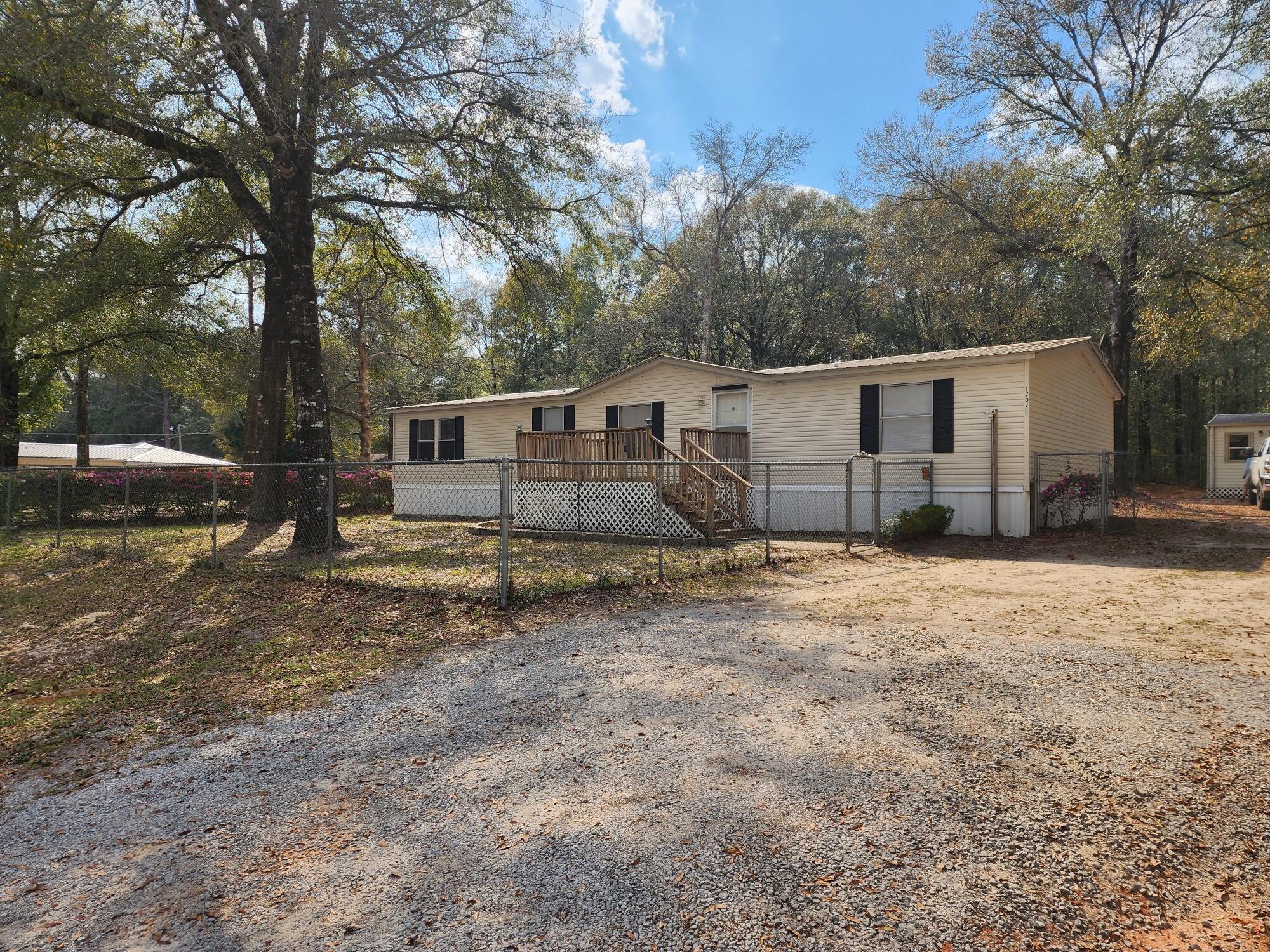 Home is located in the much desired Baker area! This move in ready home would be an excellent investment as a rental property or your forever home. This 3/2 home offers a split bedroom floor plan. Open and spacious living area with separate dining. Kitchen has pantry and island. Master Bedroom has walk-in closet. Master Bath has corner garden tub with separate shower. Hall bathroom has skylight for natural lighting. Each bedroom has ceiling fans too. Yard is completely fenced, with separate fencing in front and back. Room dimensions are approximate and will need to be verified.
