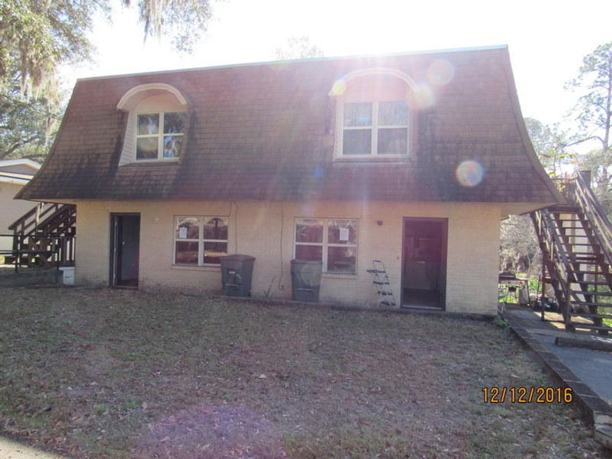 This auction REO home is located within walking distance of Milton High School, businesses, and churches. A 4 plex, there are 2 units downstairs and 2 units upstairs. Each unit is identical in layout and is 1 bedroom and 1 bath. All units have a water view of the lake directly behind the property. Building needs work and therefore may not qualify for most financing. Not all units are vacant at this time some trespassing on the occupied units is not acceptable and a criminal offense. Call today! Seller's asking price is $89900