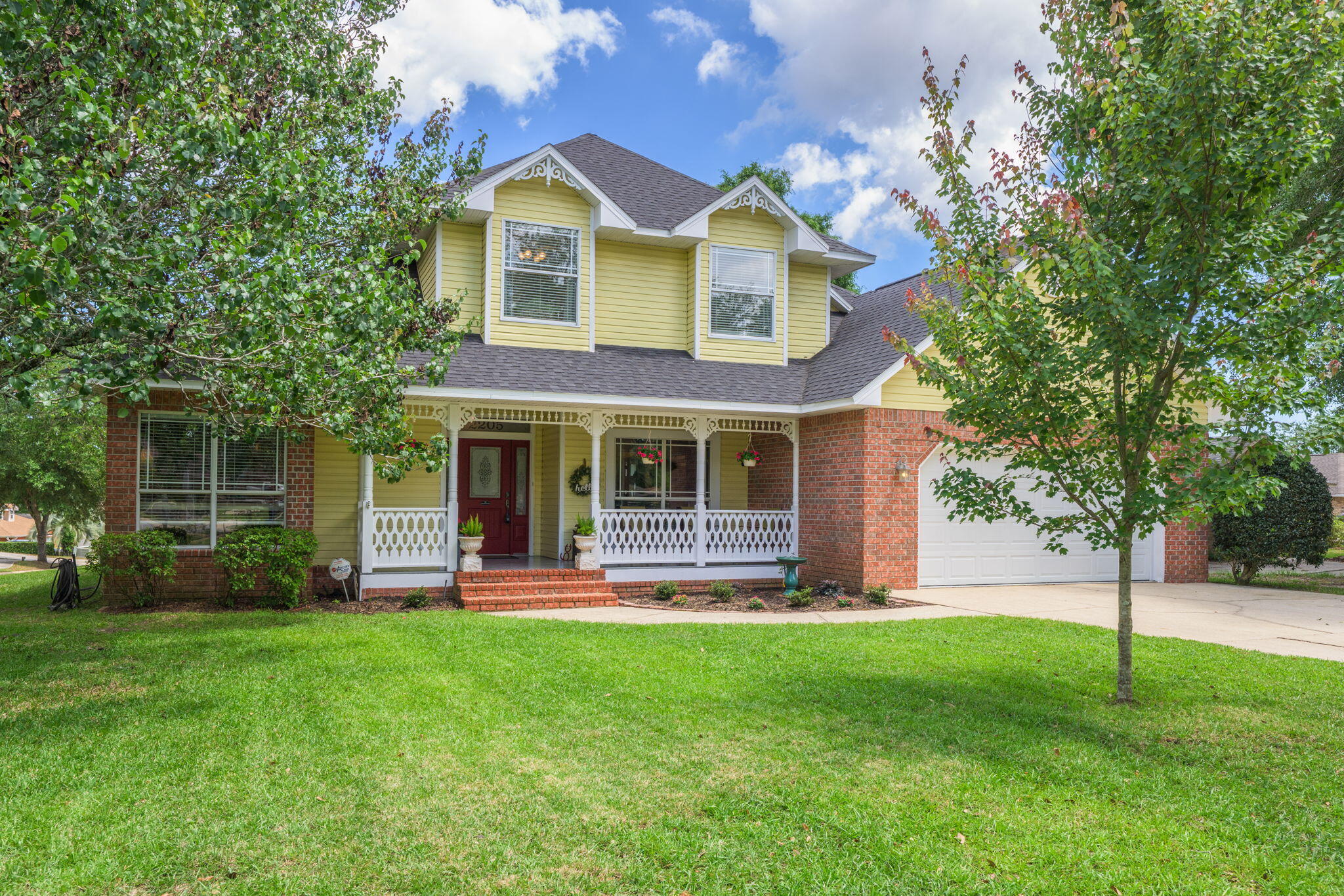 Welcome to this inviting family home full of character, perfectly situated on a corner lot in the Creekside Oaks neighborhood! Outside, the luscious lawn and quaint covered patio welcome you to relax. This property has been meticulously cared for and thoughtfully updated, featuring a brand-new (2025) HVAC system with an advanced ozone air purifying feature and a dual-zone system with separate controls for upstairs and downstairs, as well as a roof that's only four years old! Inside, you'll find a traditional yet thoughtfully laid-out floor plan with four spacious bedrooms, two full bathrooms, and a wealth of character. Beautiful touches like stained glass, wainscoting, crown molding, and hardwood floors add elegance and elevate the home. The formal dining room is perfect for entertaining or making it a flex space, while the cozy dining nook off the kitchen makes everyday meals feel special. The kitchen is functional and stylish, with elegant white cabinetry, sleek granite countertops, stainless steel appliances, an expansive walk-in pantry, and a charming window over the sink that looks out onto the manicured backyard. Just off the kitchen, French doors open into a spacious living room with carpeting, abundant natural light, and a fireplace that adds coziness. The downstairs primary suite is a true retreat, featuring a spacious layout and crown molding. The ensuite bath is complete with double vanities, a separate shower and garden tub, and a large walk-in closet. Upstairs, you'll find three generously sized bedrooms and a full bathroom with a tub/shower combo and extra storage. The garage is deep and oversized, with built in storage shelving and a work bench. Step outside to a backyard designed for entertaining, with a screened-in patio, open deck, mature shade tree, and lush grass! Located centrally in Pensacola, this home offers easy access to I-10, schools, hospitals, and shopping. This home is move-in ready and waiting for its next family to make it their own!