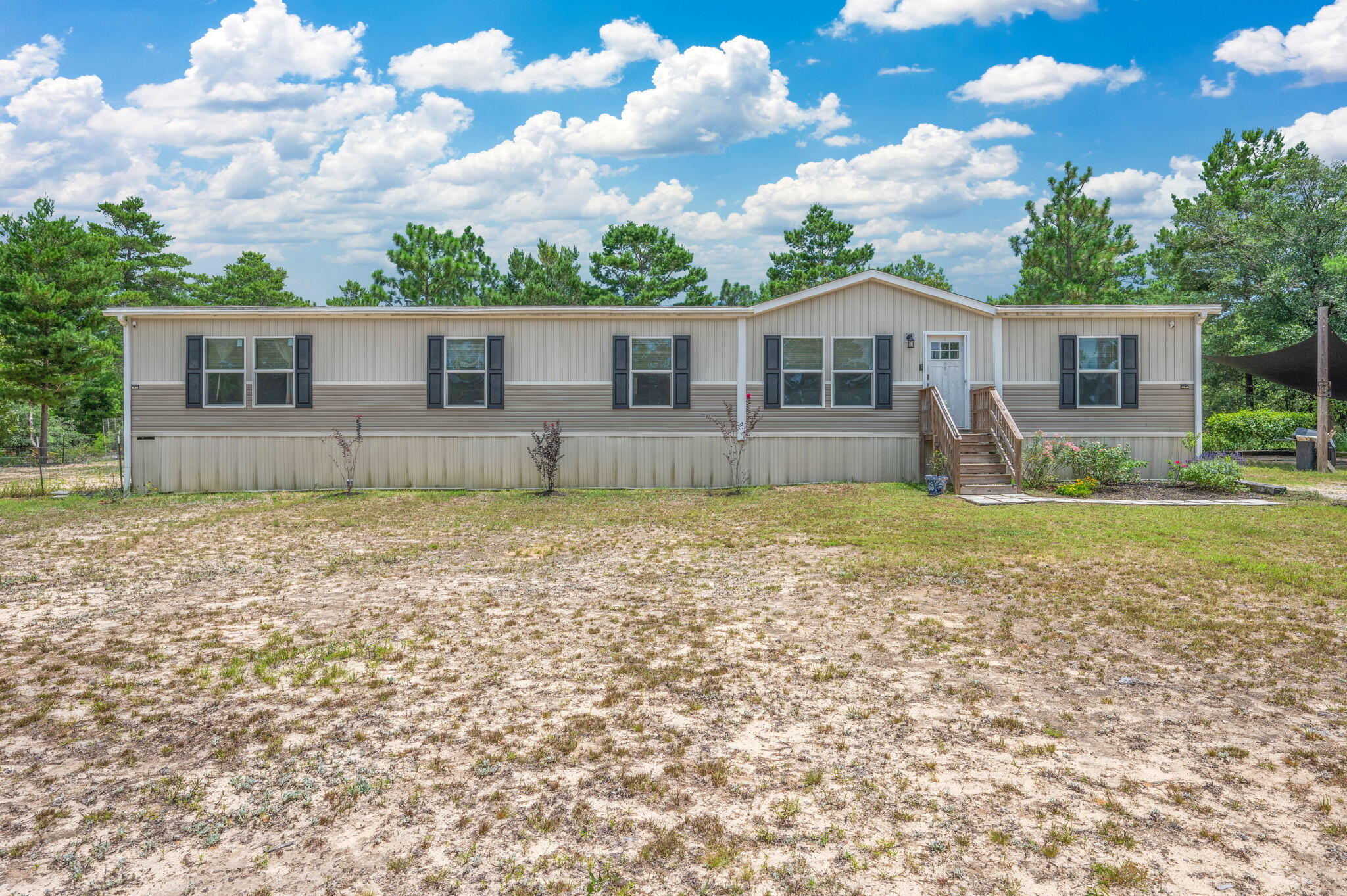 Located just off I10 and Hwy 285 this 4 BR, 2BA manufactured homes location is perfect for an easy commute to Eglin AFB, Duke Field, and the South end to the Beach! Offering over 2280 sqft built in 2021 this home sits on 1 acre and has a large living room, dining room, kitchen concept with a breakfast bar and tons of storage! The space is welcoming and works well for any family to enjoy one another. The home offers a split floor plan, and the master suite offers double vanities, tons of storage, and separate shower. All bedrooms include walk in closest which is ideal for storage! Home also includes a great laundry room with cabinets and welcomes you to the back yard. The exterior offers an amazing storage building that can easily be converted to a home office. Call today to see this one!