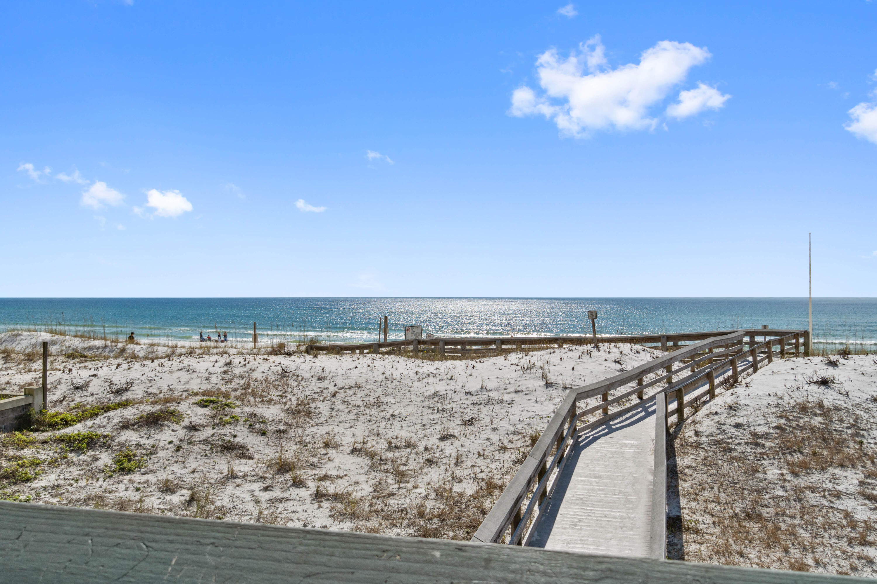 Beautifully updated second floor Condo on Okaloosa Island. Unit was fully remodeled down to the studs. Everything brand new, appliances, cabinets, lighting, flooring, bath fixtures, windows, ac and heat, hotwater heater + much more. Walking distance to Dolphin Beach Access 1 on the Gulf Side via a boardwalk or take the same Boardwalk in the opposite direction to the Bayside. (Santa Rosa Sound). No need to drive to take your paddle board or surfboard, just walk to the beach with your board. Plenty of restaurants and shopping just a few minutes walking distance or a short drive (or walk) to the Boardwalk, Gulfarium & Wild Willy's Adventure Zone. Unit originally a 2-bedroom, owner converted one of the bedrooms to extra living room area. Only one parking space. Washer&Dryer Incl. New roof 202
