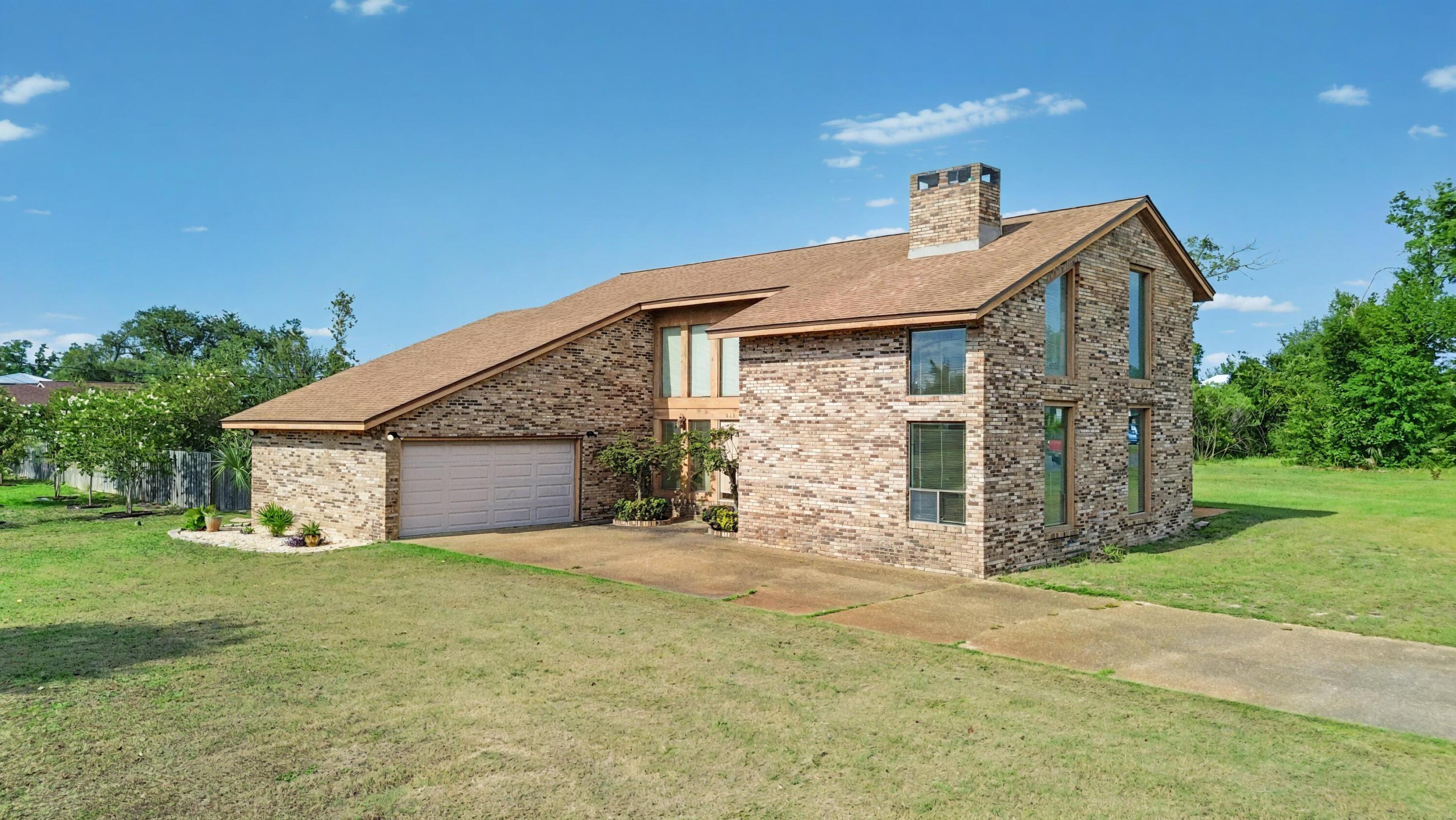Spacious Home on over half an acre in the heart of Lynn Haven! Welcome to 833 W Pierson Drive, a custom-designed and built 3-bedroom, 2.5-bathroom, 2,742 sqft brick home on just over half an acre in the heart of Lynn Haven. This home offers the perfect blend of space, charm, and potential, nestled on a quiet street close to schools, the Porter Park boat ramp, rec center, local parks, and all the shopping and dining Lynn Haven has to offer. Built with care and craftsmanship, this two-story home features a functional brick fireplace with custom-built mantels on both sides, oak paneling in the game room, and beautiful Brazilian cherry floors in three rooms and the hall. The kitchen has been updated and includes a JennAir downdraft cooktop and a new Whirlpool dishwasher ready to be installed. The master suite boasts a steam room, whirlpool tub, and tile shower, while the garage includes custom shelving, storage cabinetry, and pegboard for tools. Additional highlights include a new roof (2019), several replaced windows, a large deck for entertaining, and a huge yard with plenty of room to personalize. While move-in ready, much of the home remains original, providing a fantastic opportunity to update and build equity over time. Whether you're a growing family looking for room to spread out or a buyer looking to modernize and make it your own, 833 W Pierson Drive is full of potential. Schedule your showing today and experience this Lynn Haven gem for yourself!