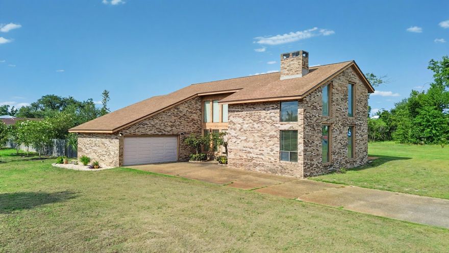 Spacious Home on over half an acre in the heart of Lynn Haven! Welcome to 833 W Pierson Drive, a custom-designed and built 3-bedroom, 2.5-bathroom, 2,742 sqft brick home on just over half an acre in the heart of Lynn Haven. This home offers the perfect blend of space, charm, and potential, nestled on a quiet street close to schools, the Porter Park boat ramp, rec center, local parks, and all the shopping and dining Lynn Haven has to offer. Built with care and craftsmanship, this two-story home features a functional brick fireplace with custom-built mantels on both sides, oak paneling in the game room, and beautiful Brazilian cherry floors in three rooms and the hall. The kitchen has been updated and includes a JennAir downdraft cooktop and a new Whirlpool dishwasher ready to be installed. The master suite boasts a steam room, whirlpool tub, and tile shower, while the garage includes custom shelving, storage cabinetry, and pegboard for tools. Additional highlights include a new roof (2019), several replaced windows, a large deck for entertaining, and a huge yard with plenty of room to personalize. While move-in ready, much of the home remains original, providing a fantastic opportunity to update and build equity over time. Whether you're a growing family looking for room to spread out or a buyer looking to modernize and make it your own, 833 W Pierson Drive is full of potential. Schedule your showing today and experience this Lynn Haven gem for yourself!