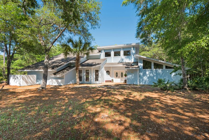 72 hour kick out clause in place. As you step inside this home, picturing yourself inside a cozy cabin is inevitable. At first glance your eyes are drawn to the natural landscape that surrounds the back of the property. The natural tones and expansive windows evoke a feeling of relaxing in the woods. The first floor offers a variety of living space options. A large living room with vaulted ceiling make for an open and airy space with the added convenience of a wet bar and pass through to the kitchen. The adjoining kitchen includes granite and stainless appliances with a wood paneled ceiling. Relax at mealtime in the breakfast area just off the kitchen. Perhaps a more natural dining room appeals to you -  just off the kitchen is the 'Florida Room' with its wall of large windows and brick flooring could serve many purposes for this home. You be the judge of what works best. If a traditional dining room is more to your liking, this home also has a formal dining room in the front of the home. Featuring large windows, the formal dining is filled with natural light. This home also features a unique billiards room, easily transformable into a game room, large office, extra bedroom, or even a room dedicated to home schooling. As you make your way to the master bedroom, prepare for even more surprises.  Gorgeous large unobstructed views of the surroundings continue as you discover the most amazing master bath you can imagine. Treat yourself to the SPA experience with vaulted ceilings, wood featured wall, granite counters, double vanities, tile with stone shower, and Jetted Tub with wall mounted TV. It's the perfect combination to relax and wash the stress of the day away. The custom closet is a feature sure to ease those closet space squabbles. Travel upstairs where the loft space could be used for a computer niche or the perfect reading nook. Two guest bedrooms each with custom closets are separated by an updated guest bath that boasts a separate tub/shower from the vanity area. The second floor is equipped with a laundry chute creating a great time saver. There is also additional storage space that could serve many needs. In this coveted Bluewater Bay waterfront community you will find this coastal styled home fits perfectly. All of the Bluewater Bay amenities: restaurants, boating, golf, tennis, swimming to name a few are easily accessed from the community pathway that sits approx.100 yards from this home.