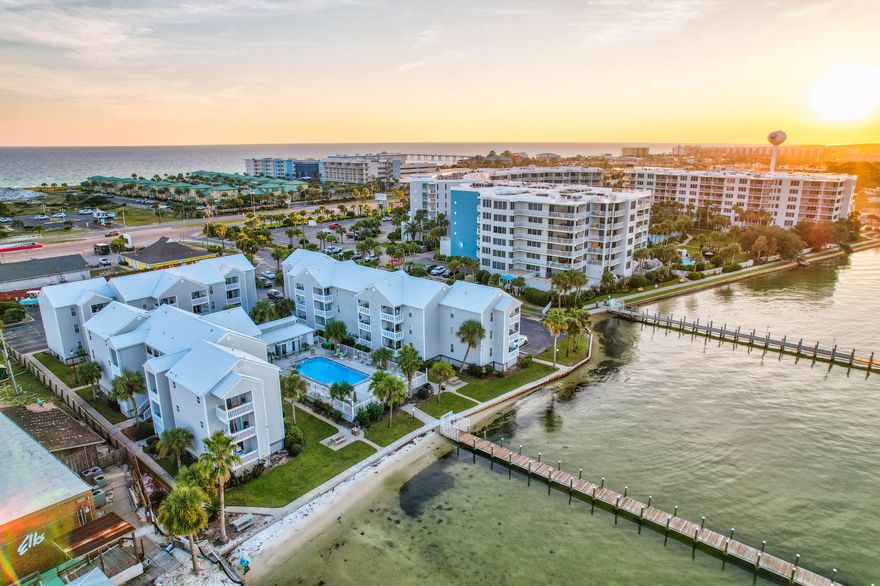 $43,000  gross done with similar units. Sleeps 6. *Virtual Tour Available*Rare Corner, first floor, two-bedroom condo with partial water views. Welcome to 1330 SE Miracle Strip Parkway #107! This first-floor corner unit kitchen features granite countertops, stainless steel appliances, a marble backsplash and white shaker style cabinets. As you step into the main living areas and bedrooms, you'll notice the luxury vinyl plank flooring, which is durable and easy to maintain. The bathrooms are tiled.