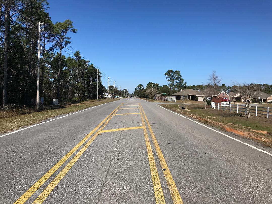 Beautiful neighborhoods across the road, and new homes being built beside this rectangular lot. Located between Gulf Beach Hwy and Blue Angel Pkwy. Restaurants, shopping, Perdido Key beaches, Naval Air Station Pensacola, are all within immediate area or easy driving distance. Just 16 minutes to Downtown Pensacola or 13 minutes to the beach at Perdido Key. This piece has wetlands so mitigation would need to be completed in order to build, with the remaining trees as the perfect privacy buffer between you and the neighbors. Buyer to verify all measurements and pertinent information.