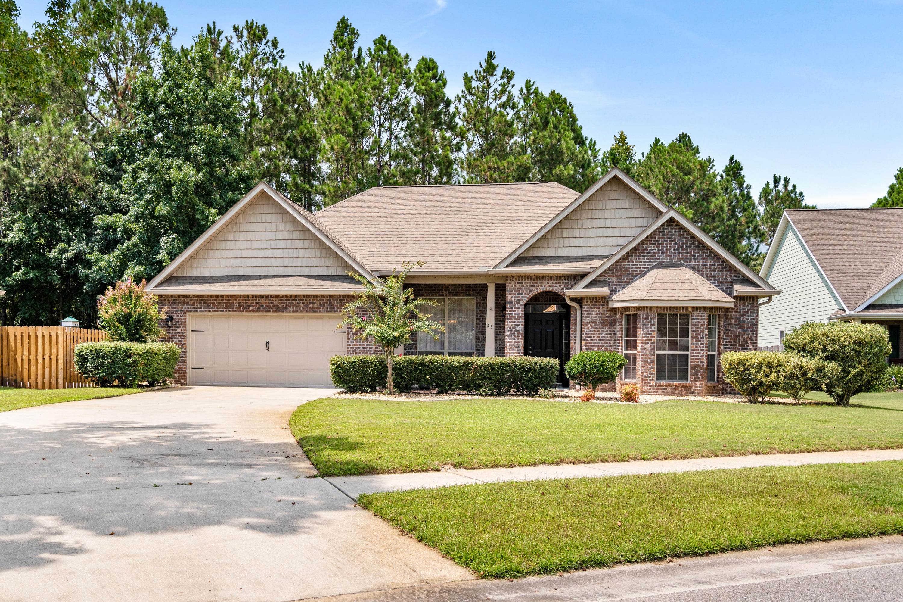 Spend your time on the 12 miles of nature and bike trails, at the fitness center, or laying at the pool when you buy this all brick, low maintenance home in the Symphony Neighborhood. Open concept living with a vaulted ceiling in the living room and a tray ceiling in the dining room. The Master Bedroom has a tray ceiling as well as an attached sitting area. This home offers 2 additional bedrooms. Master bath has double vanity, separate tub, shower, and huge walk in closet. In the kitchen you'll find granite countertops and plenty of counter space. The back porch provides views of the large backyard and nature preserve area. The yard is landscaped and includes irrigation with a well. Termite Bonded, wired for surround sound and alarm system