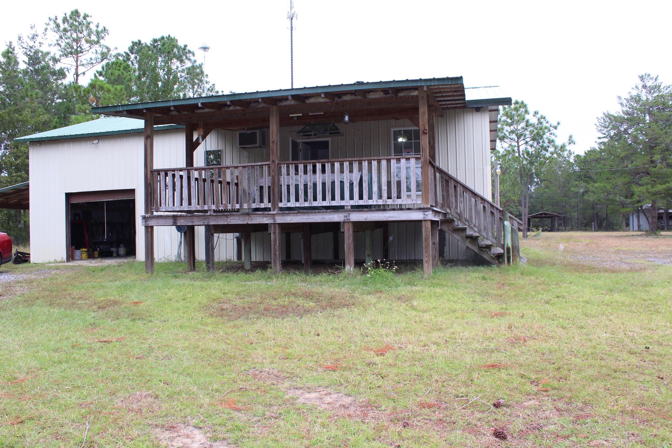 REDUCED!!! Two bedroom, one bath home, with kitchen / dining / living area combination. The kitchen includes a pantry, with a smooth top stove. Home also has a wood burning stove that is utilized as a heat source. Home includes a large covered front porch area. Secluded home, close enough to Hwy 331, yet far enough away to be in the country. Spacious clean yard, that includes two pole barns with electrical hookups.