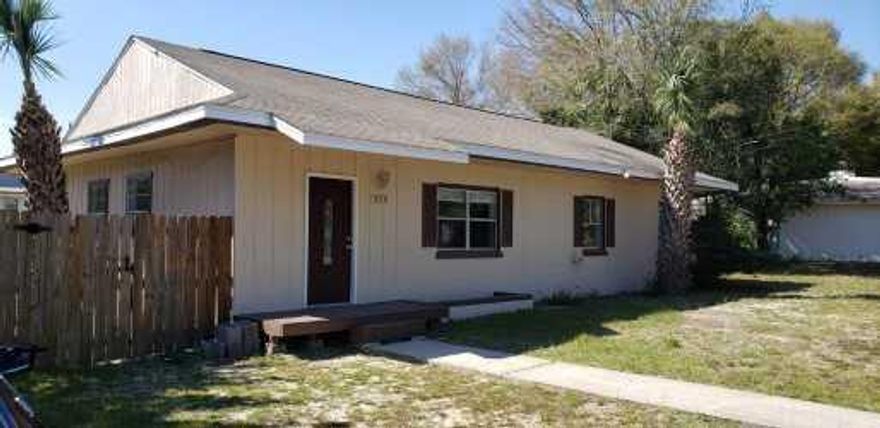 Seller is offering $3000 allowance for upgrades. Laundry room could be converted to a bathroom. Convenient to Eglin AFB, 2 blocks from the water (no flood insurance required), kids park and boat ramp 2 blocks away, and a walk to the elementary school. Low maintenance 3 bedroom, 1 bath, all tile, new water heater, newer A/C, roof is 3-4 years old, detached laundry room with plenty of space for a hobby room, and a bonus room with a big window. This is on a large lot with plenty of parking. This is zoned for residential or commercial.