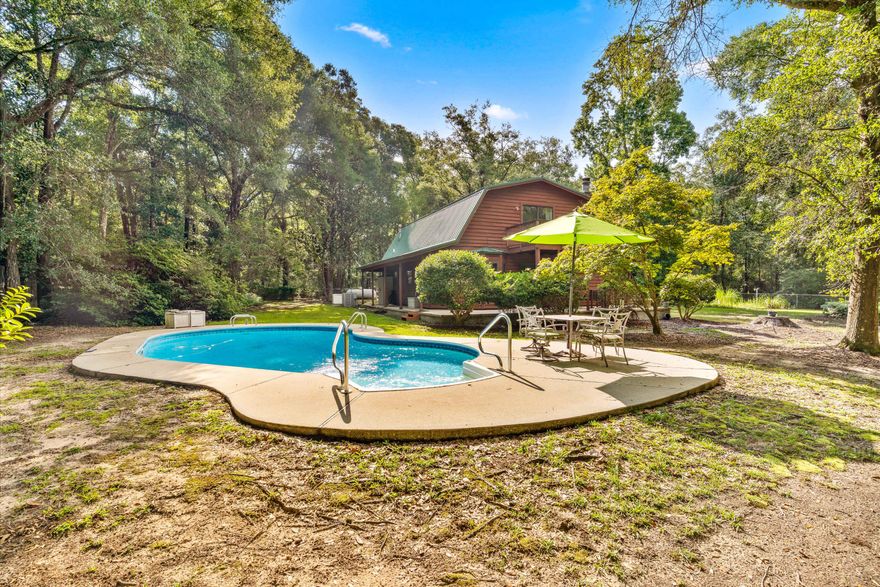 Your Private Cedar Country Oasis AwaitsEscape to peace and privacy in this stunning 1,900 sq ft cedar country-style home, perfectly situated on nearly 4.5 acres of secluded, wooded land. Fully fenced for security and peace of mind, this property is ideal for families, pets, and anyone craving space and serenity.Inside, the home radiates rustic warmth with rich exposed wood throughout, creating a cozy and inviting atmosphere. A charming fireplace anchors the living space--perfect for cool evenings. The home features 3 spacious bedrooms and 2 full bathrooms, offering comfort and functionality for everyday living.Modern updates include a tankless water heater for endless hot water, a two-year-old HVAC system for year-round , and a whole-house generator to ensure you're never left in the dark.

Step outside and enjoy your own private retreat. Whether you're cooling off in the pool, relaxing on the wrap-around porch, or soaking in the views from the second-story balcony, the tranquil sounds of nature surround you.

This unique property offers the perfect blend of rustic charm and modern conveniencean ideal setting for peaceful country living without sacrificing comfort.

Don't miss the chance to make this one-of-a-kind property your new home. Schedule your private tour today!