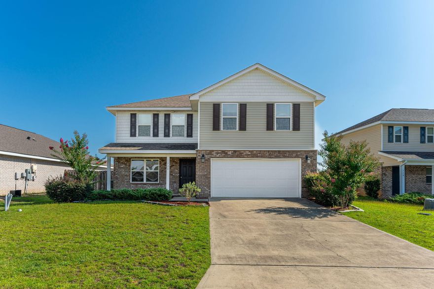 VA assumable mortgage with a 3.25% rate available for eligible VA buyers only! The current payment is $1,830 and the loan payoff is $207,000.  This beautifully maintained two-story Galen plan home, built in 2017, offers incredible value and is ideal for both entertaining and everyday family life. Featuring 4 bedrooms, 2.5 bathrooms, a two-car garage, and a versatile flex room on the main level, the layout is both functional and spacious. The open-concept main floor boasts a large great room and a kitchen with a generous island bar, shaker-style cabinetry, stainless steel Frigidaire appliances, a walk-in pantry, and vinyl flooring in the main living areas. French doors lead to a patio overlooking a private backyard. Upstairs, you'll find all four bedrooms, including a spacious owner'ssuite offering complete privacy. The suite includes a walk-in closet, soaking tub, separate shower, and dual vanities. The three additional bedrooms are well-sized to accommodate a growing family. The exterior is finished with a combination of brick and vinyl siding for lasting durability and curb appeal.  Additional features include a two-car garage and access to wonderful community amenities such as a zero-entry pool, playground, and dog park. With an acceptable offer, the seller is also willing to paint the interior of the home in one color of the buyer's choosing.  Redstone Commons, a charming subdivision in Crestview known for its beautifully landscaped streets and thoughtfully designed homes, the neighborhood blends modern comfort with a peaceful suburban feel. Conveniently located near shopping, dining, top-rated schools, and major transportation routes, Redstone Commons makes everyday living easy. Outdoor lovers will appreciate nearby parks, green spaces, and the short drive to the stunning beaches of the Florida Gulf Coast. 