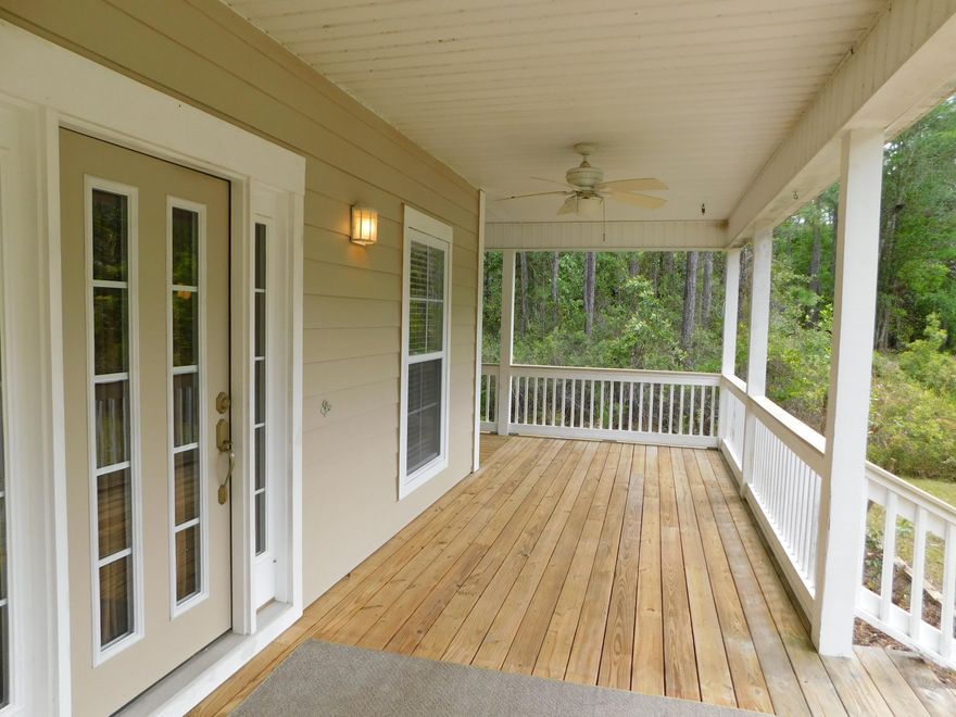 Move-in ready. Easy maintenance concrete boards siding. Wonderful, entertainment ready veranda porch that runs along front side and back. Just 1/2 mile to US Hwy 98. Only 3 miles to the word renown sugary beaches of the Florida Emerald Coast. This immaculate, pride of ownership features oak cabinets in kitchen, stainless steel appliances, Italian marble tile counter tops, beautiful back splash and double tier breakfast nook. Kitchen opens up to the living room for easier interaction with guests. Outlets on bedrooms are controlled on wall switches. This property would be a nice residence, a beach vacation home, or an income producing property. Short term rental allow. NO HOA. The adjoining 4 lots are available for sale for $57,000 per lot. See MLS 821063, 821064, 821065 and 821066.