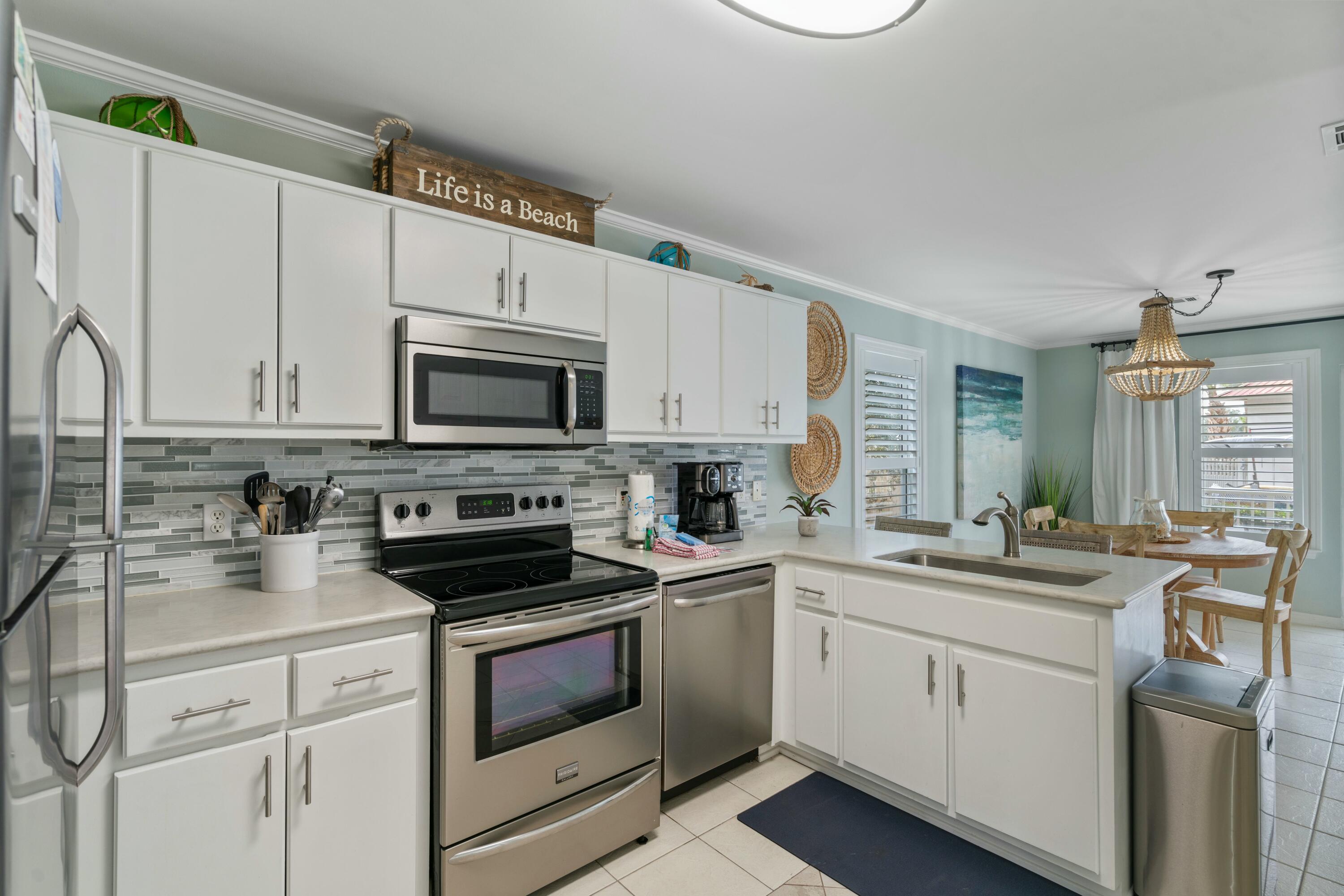 Nicely updated and well maintained unit in popular Rollin Tide Villas in Seagrove Beach! Upgraded throughout, with quartz countertops, glass tile backsplash, and stainless appliances in the kitchen. Shiplap feature wall in the bedroom with barn door access to the upgraded bathroom, again with a quartz countertop! The unit also features scraped ceilings with crown molding and plantation shutter window treatments. Offered with tasteful, modern coastal furnishings and decor. Too much to list! Relax at the pool directly behind the unit, with convenient bathrooms and 2 BBQ grill stations, or take a short walk to one of the multiple public beach access points nearby. New beach access directly across from Cafe 30a being worked on now also, to be completed soon!