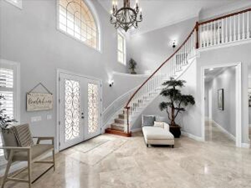 Price improvement! Welcome to your coastal paradise at 490 Regatta Bay Blvd in beautiful Destin! This spacious home offers over 4,000 square feet of living space, featuring 4 bedrooms and 4 1/2 bathrooms. You'll find a master suite on the main level, as well as a second master upstairs.The oversized 2-car garage provides ample parking.Inside, the open and airy living space boasts a dramatic staircase, 20-ft ceilings, and large windows that flood the living room with natural light. The updated kitchen is perfect for entertaining.Enjoy the large enclosed saltwater pool with a hot tub, all within a fenced yard for privacy.