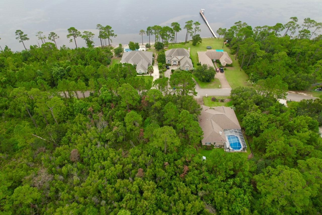 Florida living and paradise are within David's Landing. This lot is located steps away from the Santa Rosa Sound, and is the perfect location if you're looking for serenity as well as being discreet. The land is ideal for those envisioning to build their dream home, while still being close to shopping and attractions. Come see just how beautiful the views really are!