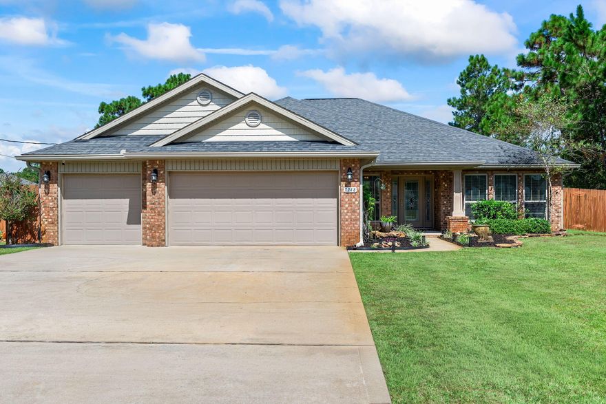 This beautifully designed 4-bdrm, 3-bthrm home offers the perfect blend of comfort and versatility and is exceptionally located on a quiet dead-end street in the desirable Holley By The Sea community. This plan features an open spacious main living room, dedicated dining area, a roomy breakfast nook, an office/sitting room and a Florida room with countless other possibilities. The kitchen has attractive granite countertops, an island with breakfast bar seating, pantry, and a new dishwasher. This split bedroom plan allows for additional privacy in the primary suite, which includes a luxurious walk-in tiled shower and two walk-in closets. The outdoor space is just as impressive with a large covered patio that has been extended creating the perfect sitting area for relaxing in the evenings. There is plenty of room on this large 1/2-acre lot for a future pool and entertaining is made simple with direct access to a bathroom from the patio. Additional highlights include front and rear rain gutters, a huge 12' x 25' workshop/garage with loft storage, wood privacy fence and Florida style landscaping. Holley By The Sea, residents enjoy access to multiple pools, a recreation center, workout facility, pickleball courts, sauna, waterfront access, a boat launch and more. This neighborhood offers not just a home, but a true lifestyle.