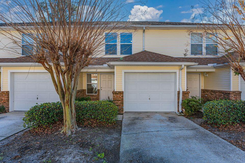 Centrally located two bedroom 2.5 bath condo, includes 1 car garage and fenced back porch. Large living area on the 1st floor as well as a breakfast bar. Wall to wall carpet with Tile foyer and tile kitchen. Unit is vacant and easy show. New roof 2024, new Hot water Heater 2024, AC 2017.