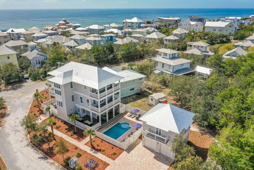 Look no further than this exquisite 6-bedroom, 6.5-bath for the perfect 30A getaway! With Gulf views, a gorgeous private pool, multiple decks, a chef's kitchen, and a short walk to the beach, this professionally decorated Seagrove Beach retreat by Eastern Lake is it. The kitchen features designer cabinets, a gas range, and select stainless appliances. Magnificent hardwood floors open onto the dining area with table seating for 8 and island counter seating for 5. Relax in the living room before a stunning fireplace and a vast flat-screen television, and take your morning coffee out to the deck for a birds-eye view of the Emerald Coast. Aquamarine waters and white quartz sand beaches are just a short walk away.