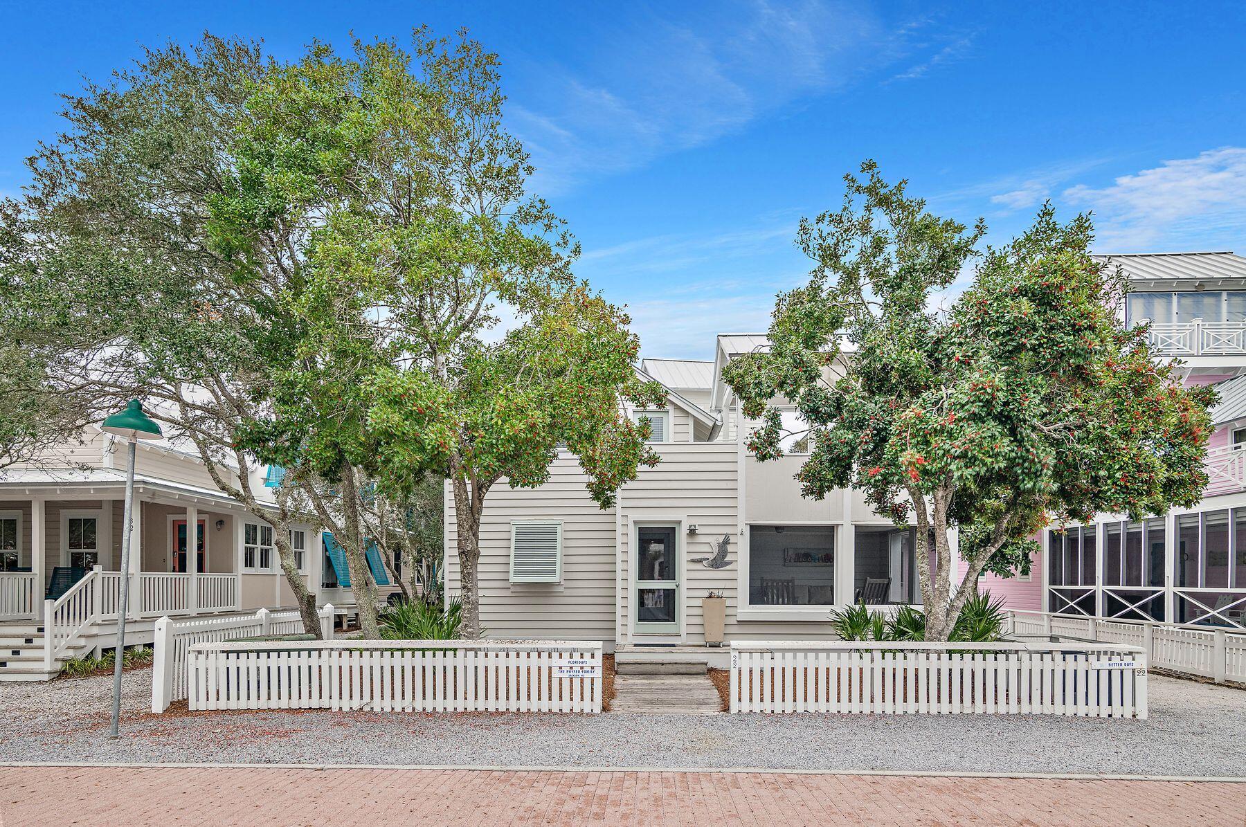 Combining laid-back living with the best gulf views, this Seaside, Florida, cottage has the rare luxury of off-street parking on the rear private driveway. Sitting behind a white picket fence on a generous lot, this attractive home has a beautiful carriage house as well as a new roof and newly painted siding. Step inside and admire the light interior decor, cozy fireplace and lofty ceiling adding a sense of airy spaciousness to the open living room. Wood flooring continues into the dining area and kitchen, which is fully equipped for preparing family meals. Two bedrooms and a shared bath are also on this level. Head upstairs to find two additional bedrooms, two baths (one with a whirlpool tub) and a second living area, allowing families to spread out and enjoy their own space.