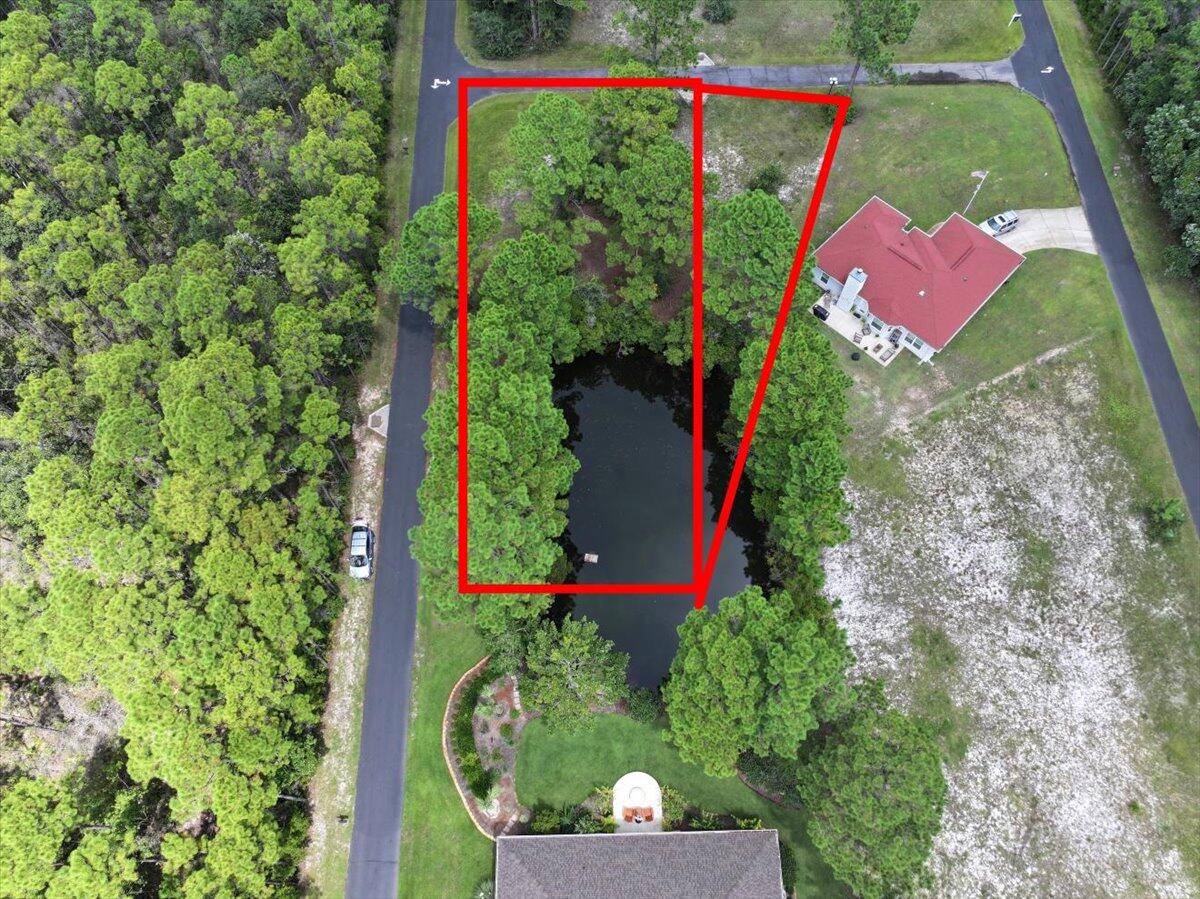 Lots 27 & 28- 1796 W Smugglers Cove Dr & 6301 Smugglers Way Two! Discover an extraordinary opportunity to create your dream home in the exclusive waterfront community of Smugglers Cove. Perched gracefully along the edge of the Intracoastal Waterway, this serene neighborhood is tucked away in a setting of natural beauty, where wooded preserves and tranquil ponds provide a sense of peace and privacy that is rarely found. Smugglers Cove is more than just a neighborhood -- it's a coastal lifestyle destination. Residents enjoy an array of refined amenities, including a sparkling community pool, clubhouse for gatherings, and tennis courts for active living. A private pier and boat launch provide effortless access to the Intracoastal Waterway, while deeded water access ensures owners can enjoy endless days of boating, fishing, paddleboarding, or simply relaxing as the sun sets across the horizon.
The community's natural surroundings create an ideal balance of beauty and convenience, offering a retreat-like atmosphere while still being only minutes from the sugar-white beaches of the Gulf of America, top-rated schools, shopping, dining, and all the best of the Emerald Coast.
This unique offering includes two adjoining homesites being sold together, presenting an expansive canvas for your vision. Complete with home plans and prior septic research, these properties provide added value and peace of mind for the next owner who desires to build with confidence. Whether you envision a coastal-inspired cottage or a grand family retreat, Smugglers Cove offers the perfect backdrop for your waterfront lifestyle.
Please NOTE: Buyer to verify all information for both lots and dimensions. Water Taps have been paid for both lots, but meter has NOT been set. Septic system has NOT been installed. No short term rentals allowed.
NO SURVEY AVAILABLE