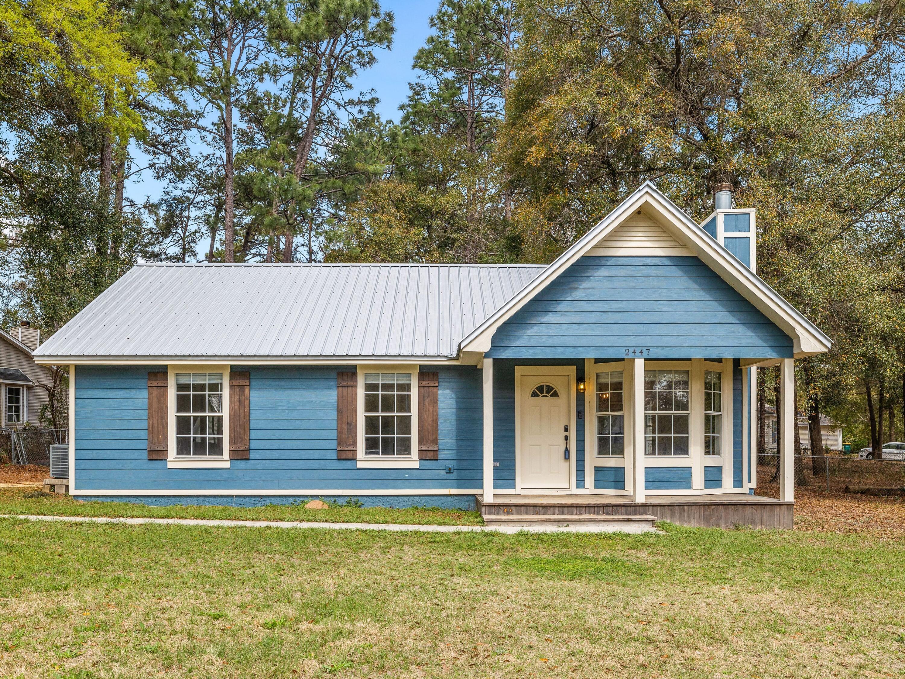 Positioned on a large corner lot in Normandy Terrace, with a generous, shaded and partially-fenced backyard, this home features three bedrooms and two full baths with thoughtful updates throughout. LVP flooring is featured throughout the home, as well as Shaker-style doors and a wood-burning fireplace in the living room, framed by a charming bay window. The kitchen is outfitted with granite countertops, Frigidaire appliances, and large pantry, adjacent to a dining area with large windows to let the sunshine in. The primary suite has an ensuite bath with a newly tiled shower and a walk-in closet. The home has a new metal roof.