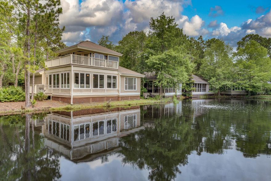 LARGER THAN MOST! Heated and cooled lanai adds more than 250 sq. ft. of  open entertaining space fronting the lake. Baypine cottage tastefully upgraded and well-maintained with a neutral color scheme being offered COMPLETELY furnished and move in ready including golf cart!! House lives as if 2 master suites. View of the lake adjoins upstairs master. Each bedroom has a its own updated bath complete with granite and new fixtures. .  Front screened porch. TWO parking pads! Exterior painted and stained and gutters installed in 2020; Open floor plan, good storage, proximity to new Aquatic Center , tennis, marina, Village, and option for vacation-rental make this a desirable neighborhood. Don't miss out on this well-priced property!