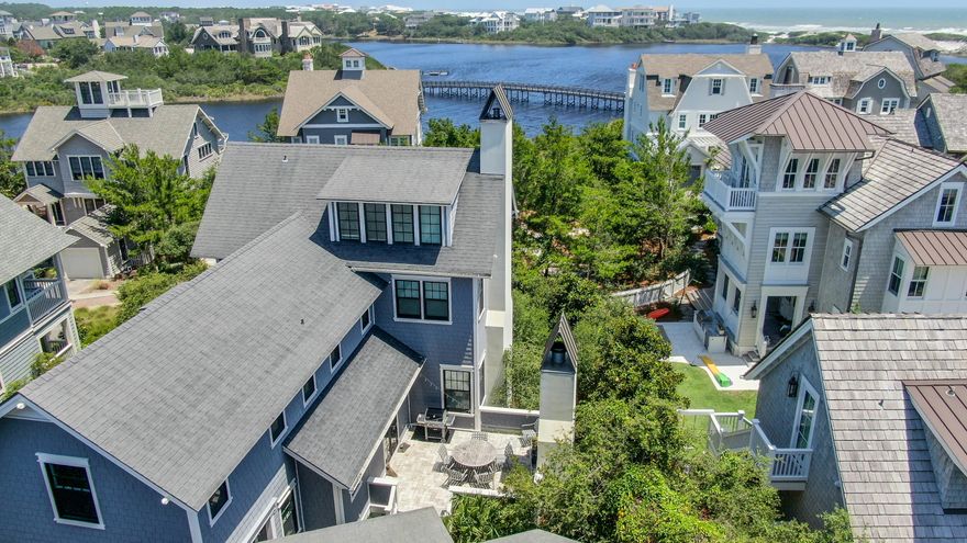 Enter the gated Bridges to see a Coastal Dune Lake and an exceptionally large corner lot to create the perfect opportunity for a family to fully appreciate this 5 bedroom with a carriage home and 2 car garage in the Bridges of Watersound.Luxury Kitchen and fireplaces are bountiful in this Coastal home. An outstanding fireplace outside that sits privately in between the carriage house and the main home creates an intimate feel.As you enter you'll appreciate the Walker Zanger Italian architectural tiles. Designed to cool in the summer and warm in the winter. The doors and windows were installed by New View windows and doors with a lifetime warranty.Private Boardwalks flank the home for a 2 minute walk to the Bridges pool.