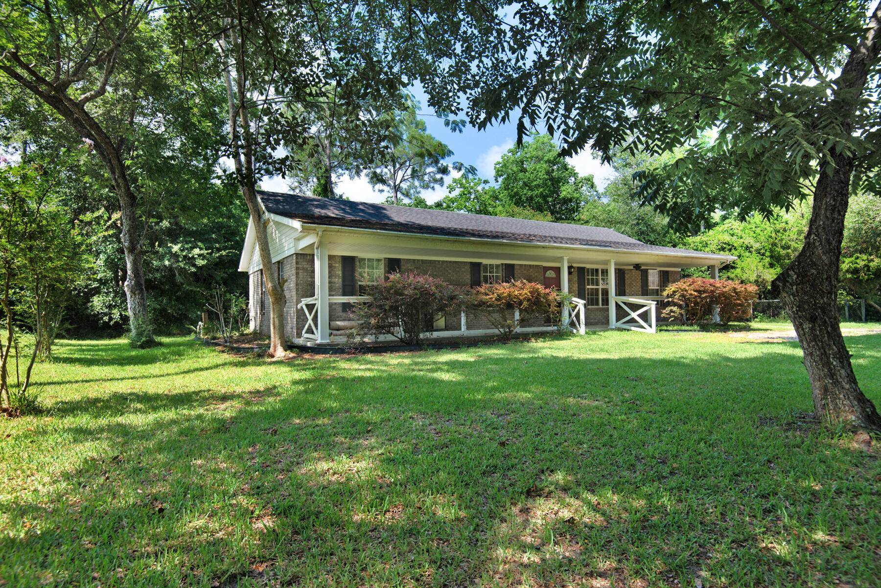 Home is under contract with a Kick-out Addendum. This beautiful, all-brick home sits on nearly an acre just off Blue Angel Pkwy, right outside the NAS Main Gate. Featuring plenty of natural light, fresh paint, and built-ins in several rooms. Watch the planes (incl The Blue Angels) fly by from the large, covered porch, and enjoy the natural surroundings. Perfect home for anyone who works/serves on base, or in the Perdido Key area. Approximately 20 min drive to downtown Pensacola and Blue Wahoo Stadium. An excellent investment property, with no rental restrictions and plenty of room to add-on.Septic system was oversized, to allow for the future addition of a 2nd full bath.Schedule your tour today!