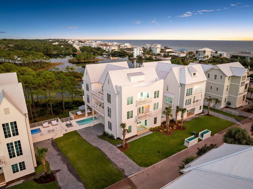 Woodward Drive is a modern beach oasis near the sought-after 30A, with breathtaking coastal vistas that will leave you amazed. The impressive 6-bedroom, 6-bathroom house has been meticulously designed with careful attention to detail throughout.As you step inside, you'll be greeted by a vision of elegance and sophistication. The interior is adorned with custom white cabinetry and crisp white walls, creating a modern and timeless aesthetic that is both chic and refined. The open plan living room and dining room are bathed in natural light and offer incredible panoramic views that will take your breath away.