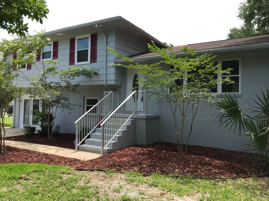 This charming three bedroom, three bath home with bonus room in easy walking distance to Destin Elementary School is perfect for a growing family. The home is located on a huge shaded corner lot with a big yard full of mature trees. This updated split level home features a main level that has a dining room / sunroom, a newly remodeled kitchen with granite countertops and newer appliances. Additionally, the main level has a large living room with a fire place and gorgeous hardwood floors. The top level consists of a large master bedroom with a freshly remodeled master bathroom. Two additional bedrooms and another newly remodeled bathroom are also on the top level. The bottom level features a bonus room with bathroom, a large laundry area, and a huge family area.