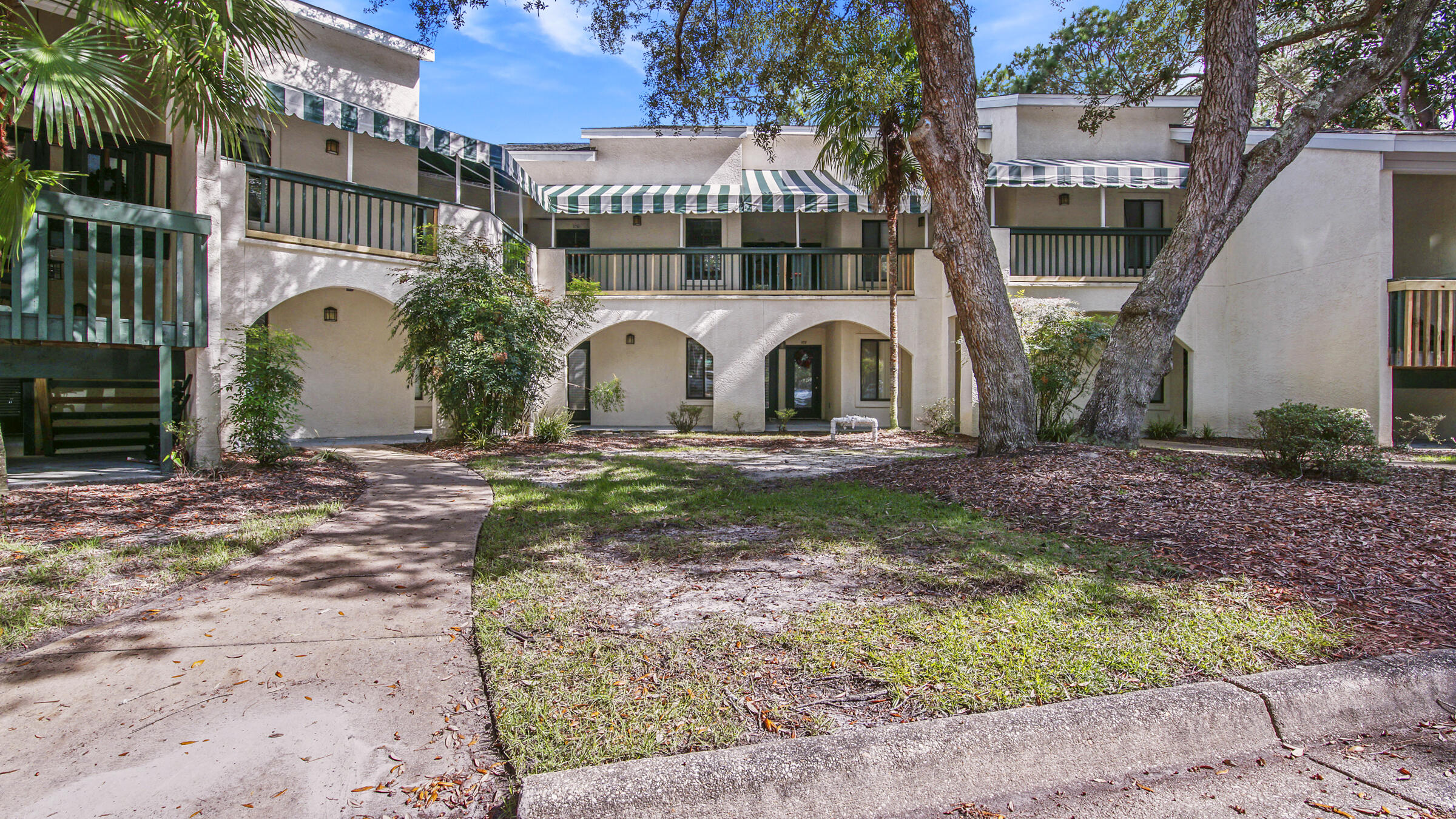 Fall in love with peaceful lake views at 108 Southlake Ct! Lakefront condo perfectly located in desirable Bluewater Bay. This beautiful 2/2 split bedroom home has much to offer. Main floor holds kitchen with new fridge, double oven, microwave, dishwasher, fresh paint, pantry. Living room has stunning lake views from covered porch, new laminate flooring and fresh paint. Large main floor bedroom has wonderful natural light and is freshly painted. Main floor has full bathroom and laundry.Second floor of unit holds freshly painted, sunny bonus room with massive closets and skylight. Primary bedroom offers amazing lake views, private balcony, built in bookshelves, fresh paint, double vanity, full bath. Home perfect for primary, secondary or investment property.