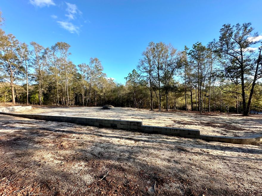 RARE FIND!,2.11 Acre DOUBLE LOT homesite! Low county taxes! Underground utilities in place with Tap fee paid! Partially cleared and graded with trees preserved to create beautiful homesite with privacy . Owner combined the 2 lots, but survey is attached showing both lots, and you could choose to build on only one side and retain the other lot to build on or sell later. Covenants and restrictions in place to preserve the integrity of the neighborhood, but there are NO HOA dues to pay! Bring your RV and/or your boat, build your workshop... there is plenty of space to create your dream estate. Located close to HWY 90 and just minutes from Crestview City limits. This convenient location provides for an easy commute to area military bases and the beaches of the Emerald Coas