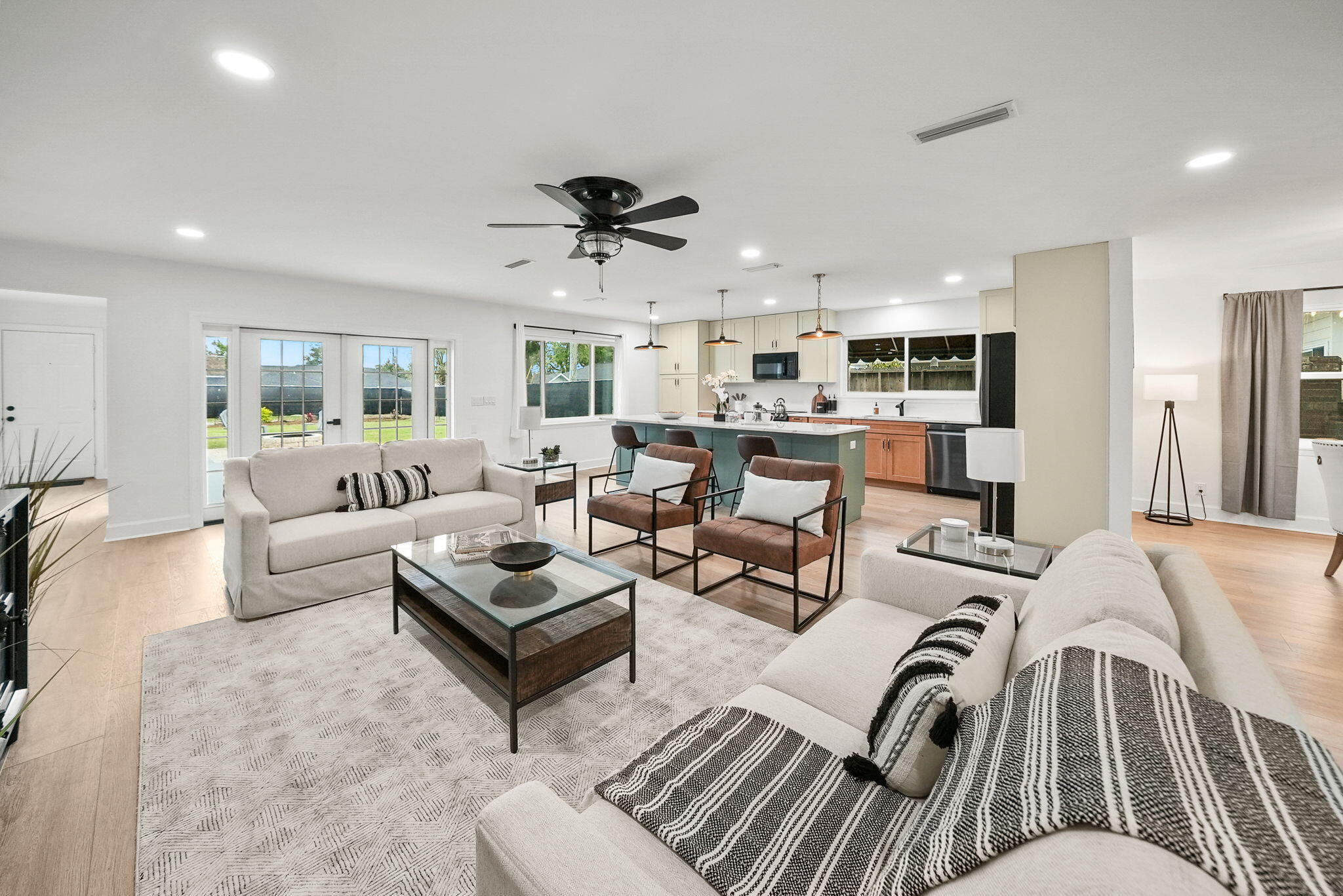 OPEN HOUSE Wednesday, 8/20 4-6pm! PRICE IMPROVEMENT on this stunning WATERFRONT home that offers two parcels - an exceptional opportunity to own the waterfront land on the BAY!Bring an offer on this waterfront home is positioned perfectly on picturesque Scenic Beach Drive, offering a unique blend of modern luxury and serene coastal living. This exquisite, recently renovated, one-story ranch-style home on .48 acres, encompasses 2,621 square feet, presents an exceptional opportunity for those seeking a slice of Florida's coveted waterfront lifestyle. This waterfront property is truly impressive-built for entertaining, complete with a back yard fire pit and ample room for a pool. Open the full glass bi-fold doors the entire length of the sitting room & enjoy sunsets year-round. And speaking of view - wait until the July 4th fireworks displays from the comfort of your own home, a hallmark of scenic Beach Drive known for its pure bay views.
The home's interior has been fully renovated as it was taken down to the studs replacing electrical, plumbing, HVAC, windows, water heater, sheetrock and more. The design truly reflects a modern, bright aesthetic and one of the best features is that it's on a single level with no stairs. The open floor plan is accentuated by abundant windows, allowing natural light to flood the space and offering picturesque views of the bay. The kitchen is a chef's dream, equipped with a large island, upgraded appliances and elegant quartz countertops. Full glass bi-fold doors in the sitting area seamlessly blends indoor and outdoor living, opening up to reveal the tranquil waterfront setting. One of the best features in this home is the open concept which provides two living areas, one adjacent to the kitchen and one overlooking beautiful St. Andrews Bay.
Boasting three spacious bedrooms and three and a half bathrooms, each bedroom is thoughtfully designed with its own en suite bath, ensuring privacy and comfort for all residents and guests. A powder room is convenient adjacent to the foyer, as well. The expansive primary suite in this single level home is a true retreat, featuring breathtaking views of St. Andrews Bay, a zero-entry, roll-in tiled shower, dual vanities and a large walk-in custom closet.
The property includes a two-car garage and deeded access to the waterfront, enhancing its appeal as prime waterfront. Its central location between the booming Downtown Panama City area and the vibrant Historic St. Andrews. Residents can enjoy walking to local farmers markets, breweries, boutique shops, and different dining options. The area is also bike-friendly and known for its community events, parades, pubs, restaurants, and marinas. The waterfront lifestyle doesn't end at home which is even more incredible! Walk or bike down Scenic Beach Drive to an array of activities allowing you to live your best waterfront life!
This property not only provides a luxurious living experience but also holds incredible rental potential with no HOA, allowing you and your guests to immerse themselves in the quintessential Florida waterfront lifestyle. You'll enjoy accessing the Bay by kayaks, paddleboards or just relaxing in the water for a swim.