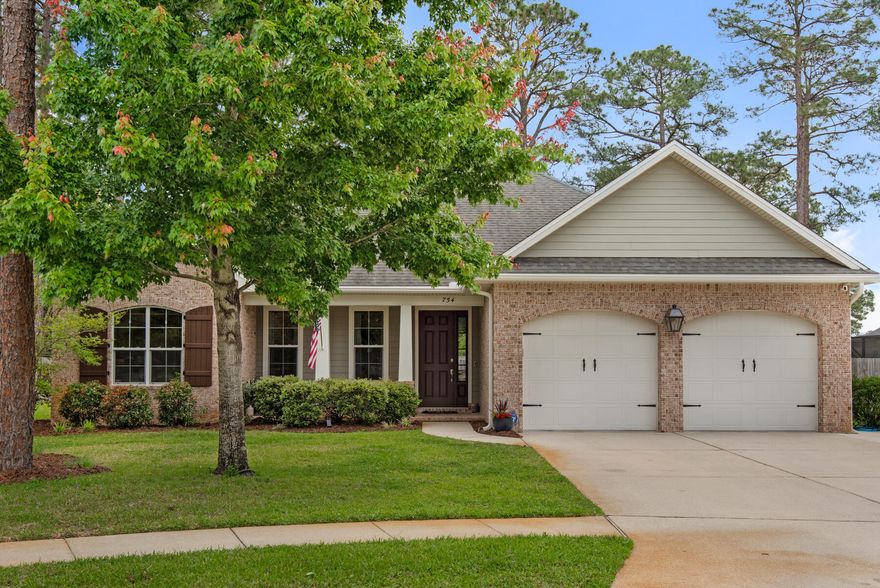 This is the one you've been waiting for! This magnificent 2013 one-of-a-kind home in prestigious Magnolia Woods is a semi-custom Huff Homes build with fabulous upgrades! The 2216 square feet live LARGE and include 4 bedrooms and 3 full baths. An open concept floor plan allows for great entertaining and seamless transitions from one space to the next. You'll enter this beautiful home from a covered  porch, large enough for furniture yet quaint and private. The custom drop zone foyer allows room for coats, backpacks, and purses to rest while the gorgeous engineered wood flooring sets the tone for an updated and modern home. From the foyer you step into the large family room that is open to the stunning kitchen and oversized dining space. The high breakfast bar boasts room for 4-6 seats -->