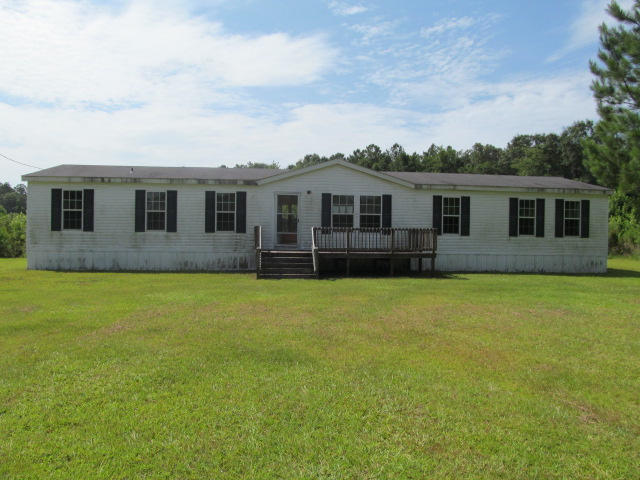 Spacious four bedroom two bathroom manufactured home with 2128 square feet. This home features a family room, living room, dining room space and a split floor plan. This home is overall in good condition but there are some repairs needed. This home sits on 2.28 acres and is located in a peaceful country setting. Property sold ''as-is''.