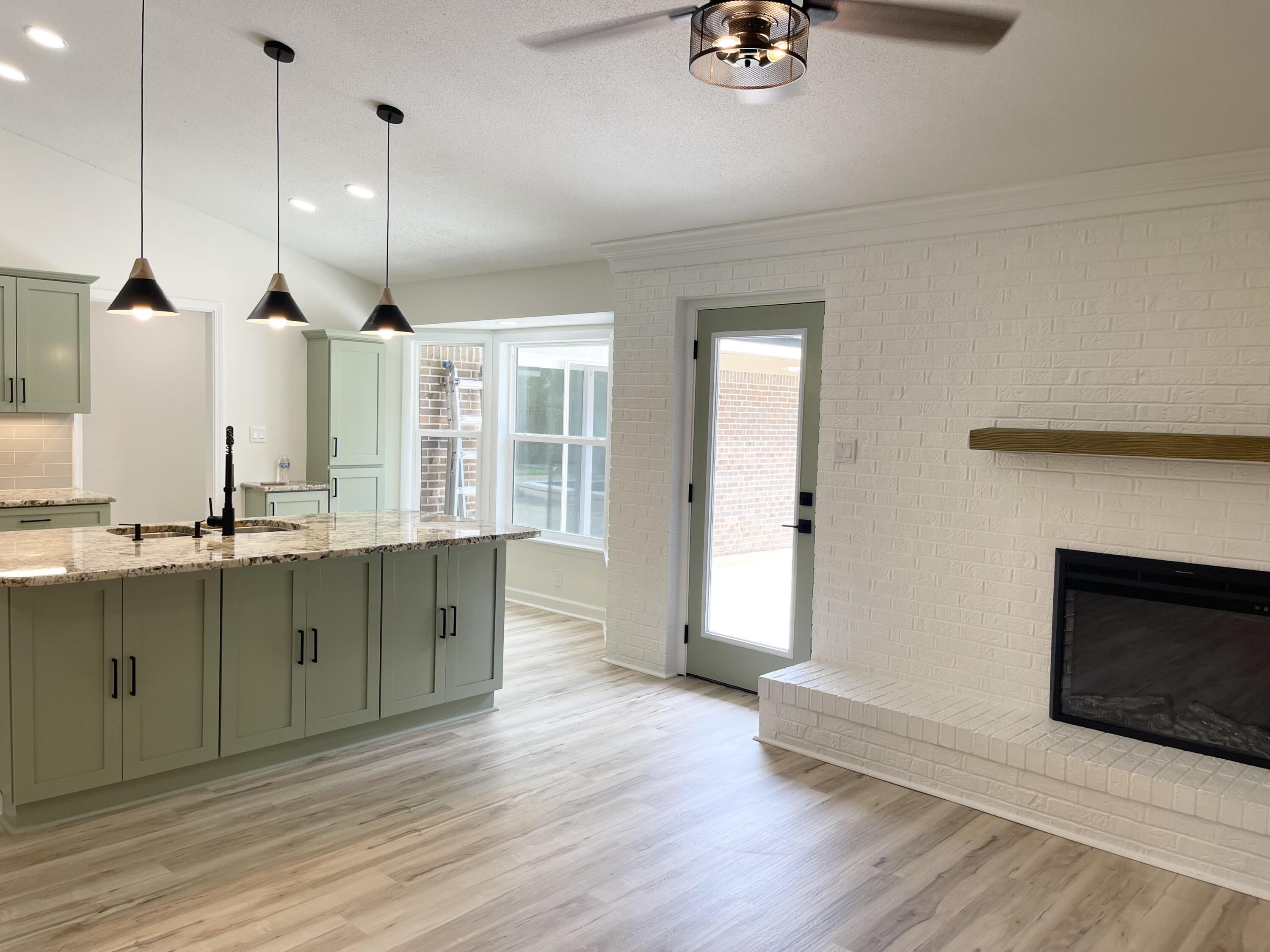 This fabulous 5 bedroom, 3 bath pool home has been completely remodeled with gorgeous, luxury finishes throughout. Situated in a quaint neighborhood with sidewalks and walking distance to the elementary school, this home will check all of your boxes! Imagine rocking on your front porch waving at your neighbors on their golfcart as they go by! If you want a home to entertain in this is it! You'll love the large patio area, fenced in secluded backyard and heated pool to enjoy all year long. Sophisticated styling and neutral color scheme throughout. There are two master bedrooms allowing one to be used as a bonus room/game room or in law suite.Metal roof 2020, 2018 HWH and HVAC, copper wiring, hurricane impact doors and windows, new stainless steel kitchen appliances, new pool liner and more