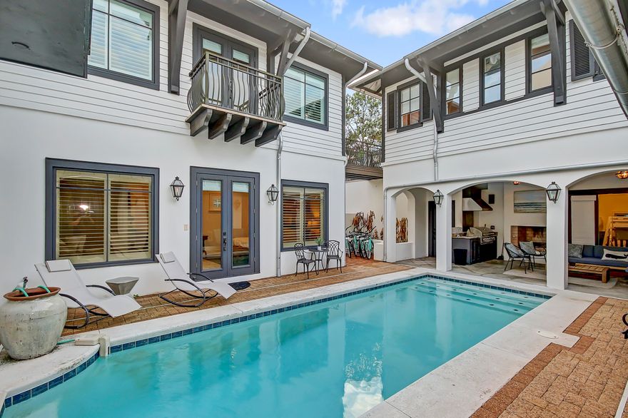 This beautiful estate home in Rosemary Beach has room for your whole family or as an excellent investment property with over $270,000 rental income and room for up to 22 guests. Enjoy refined coastal living in this recently renovated home on a large corner lot with Carriage House and Pool. The main house features 6 bedrooms with 5 bathrooms plus a large bunk room. The Carriage house, over the two-car garage, provides a king bedroom, bathroom, full kitchen and living room. The main home offers a large open area with kitchen, dining and living room which is great for family gatherings and entertaining. Features include a large fireplace and a wall of French doors which open to the pool courtyard. The large pool offers a two-story waterfall along with an outdoor kitchen with fireplace