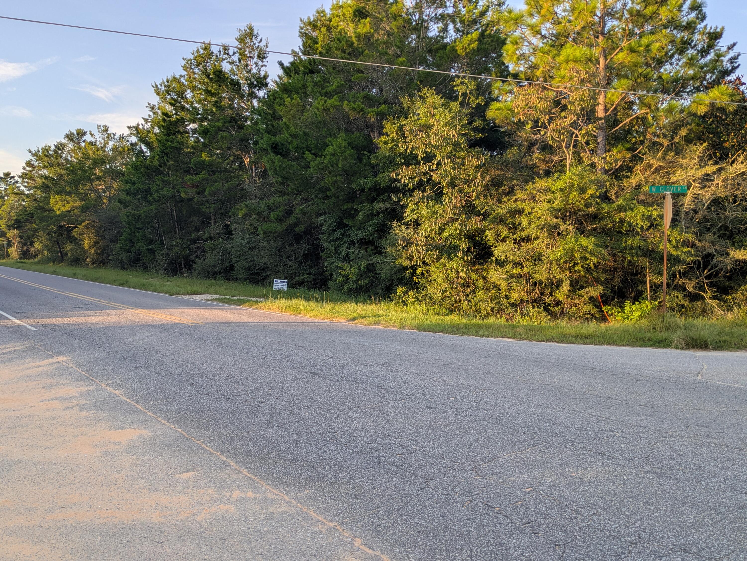 Just 1/2 mile from intersection of Hwy. 90 and Girl Scout Road, This nice and level prime corner lot on a paved road is perfect for your new home or mobile home. Lot offers Mossy Head water access, saving ~$10K compared to lots requiring a well. Electricity is available by Chelco. Buyer to verify utilities. Centrally located between Niceville, DeFuniak Springs, and Crestview, with easy access to Destin's beaches and entertainment. Seller provides survey.