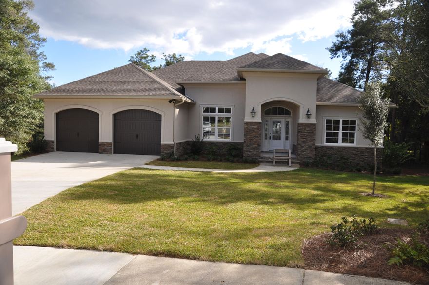 Spectacular executive home located in Swift Creek, Niceville's top upscale subdivision. This home has 4 bedrooms, 3 and 1/2 baths, library/study or office, Large great room with a gas log fireplace, and formal dining room. The large gourmet kitchen is open to the great room and to the 35x15 foot covered Balcony with an unrestricted tree top view of a green belt area. This home has ten and twelve foot elevated ceilings, and crown molding. There is a 2nd living area down stairs with a 25x17 ft rec room with wet bar, a powder room, two large bedrooms, a full bath,a exercise/TV room. Also there is over 410 sq feet of dry storage space,or work shop. This home is conveniently located just ONE block from the Swift Creek Recreational Center with an Olympic swimming pool, tennis courts, and more