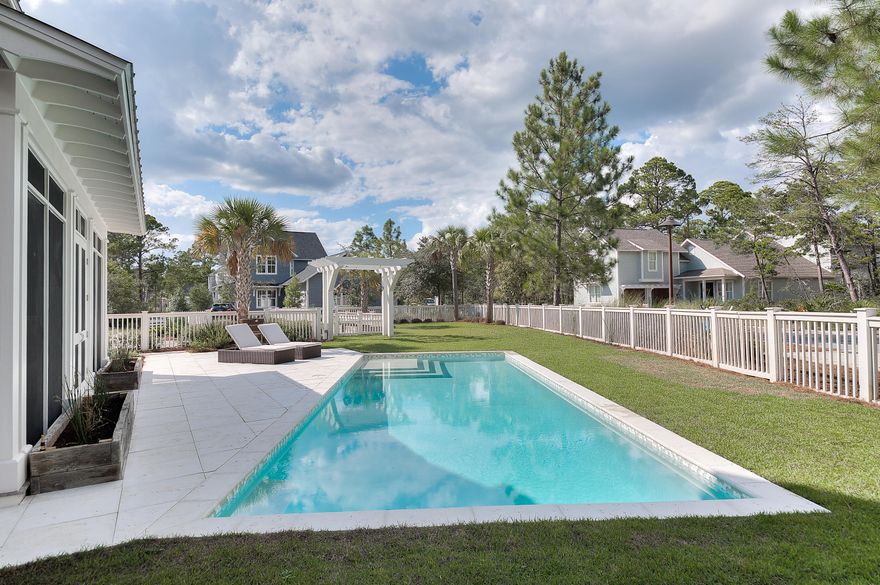 : This stunning home on a corner lot (largest lot in the neighborhood) in beautiful WaterSound West Beach is an unmatched property in its price range for 30A. This special residence offers a fenced in huge yard, amazing outdoor space including screened porch with Wolf grill overlooking the 35 foot rectangular swimming pool and lovely vegetable garden. The elegant gourmet kitchen has a large island, marble countertops, Wolf range, two ovens, warming drawer, built in steamer, Sub Zero refrigerator, and oversized pantry. The open concept great room has vaulted ceilings and walnut wood floors throughout. The spacious Master suite bath offers Calcutta marble floors and countertops with a large steam shower and tub.