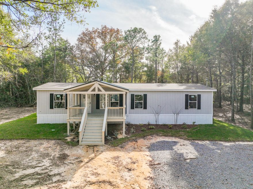 Welcome to Turkey Creek Woodlands! Seller is offering up to $3,000 towards buyer closing costs! Home warranty is included! The lots are over 1 ACRE! A large custom covered porch adorns this NEW 2023 Clayton Expedition home! The home perfectly combines elegance and functionality. This 4/2 top-of-the-line home comes with a modern, open-concept floor plan boasting 1,580 square feet of living space. This home was designed for comfort and convenience, built with the highest-quality materials and meets strict energy-efficient standards. Features include Duracraft cabinetry, Frigidaire appliances and Shaw(r) Laminate Flooring. Save thousands on utility bills with a well and septic tank! Conveniently located within 30 minutes to most of the military bases and Crestview/DeFuniak! Call today!