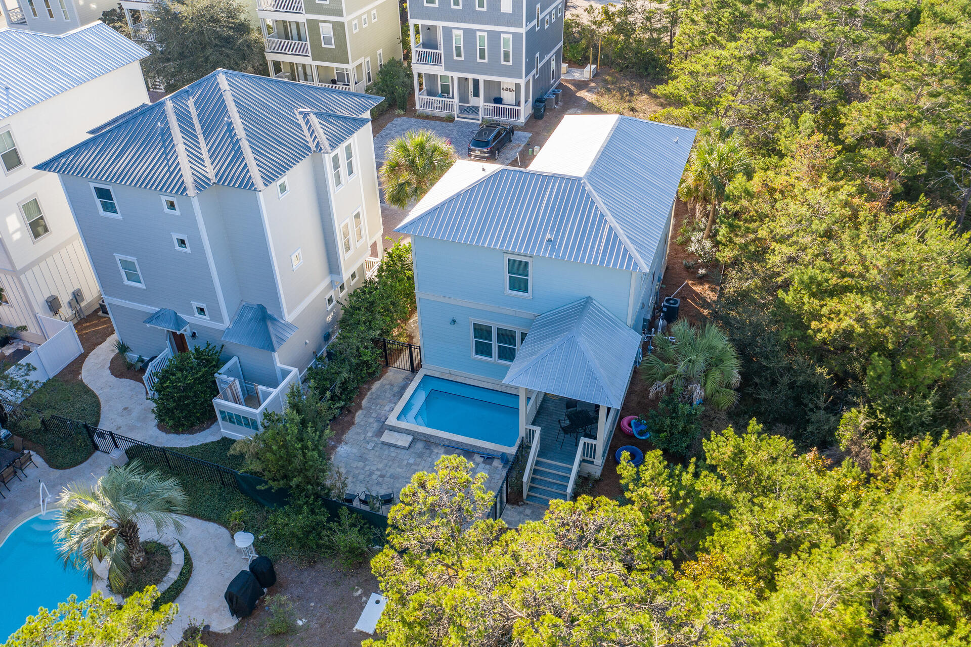 Welcome to Coastal Grove-1 block to beach, NEW private heated Pool & NO HOA! This newer beach house is a rental machine and features a gourmet kitchen with leathered Quartz countertops, Gas range, farmhouse style porcelain sink, and stainless steel appliances. Located on a quiet dead end street and with a wooded buffer on one side make this a great vacation rental or 2nd home. Walk to Shunk Gulley Oyster Bar, Perfect Pig and Gulf Place as well as 3 Beach access points- Ed Walline beach, Shellseekers & Spooky Lane. The first floor features an open floor plan with kitchen, dining & living area with 10' ceilings. Completing the first floor is a half bath and a bunk room. The 2nd floor boasts 3 bedrooms with private en-suite bathrooms and additional built-in bunks as well as a laundry room.
