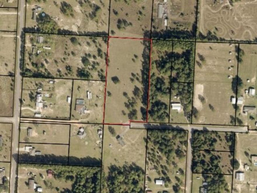 Escape to nearly 5 acres of peaceful country living on this beautiful 4.93-acre parcel, zoned Rural Residential Agriculture (AG-RR), perfect for those seeking a quiet lifestyle with room to grow. Located at the end of a cul-de-sac on a paved road, this high and dry lot is level, partially fenced, and offers a mix of open pasture and shaded trees, ideal for horses, farming, or building your dream home. With a density allowance of 1 dwelling per acre, there's also potential for low-density residential use. AG-RR zoning supports single-family homes and allows for accessory structures and certain community-oriented uses that complement the rural setting. Mobile homes are allowed, and the area features a blend of newer homes and open land. Enjoy country living just minutes from shopping in Mil ton and Pace, with quick access to I-10, making Pensacola and Navarre Beach easily accessible.