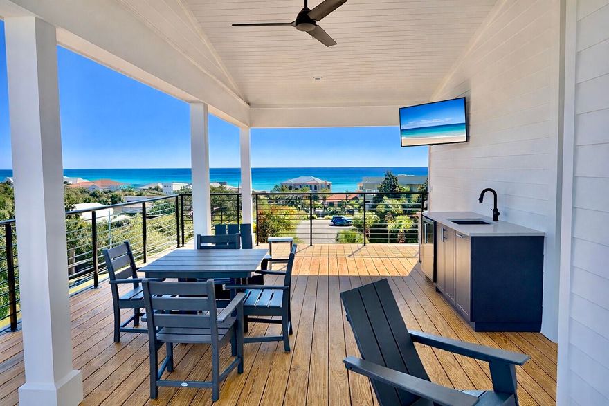 Brand-new and just finished, this four-story beach retreat sits south of Scenic Highway 30A on Mary Street, less than a 5-minute walk to the white sand beaches and emerald green waters of Blue Mountain Beach, Fla. Designed as a true rental powerhouse with projections around $235,000, this 5BR/5BA+2 half bath home is built for fun, comfort, and income. The first level lives like a poolside cabana, with a mini kitchen, half bath, and a full wall of sliders that open straight out to the private pool and sun deck--perfect for entertaining. Upstairs, the main living floor offers a large open kitchen, dining, and living area with Thermador appliances, a gas range, a sweeping island, and a walk-in pantry, ideal for big groups to gather. The whole second floor is dedicated to this open