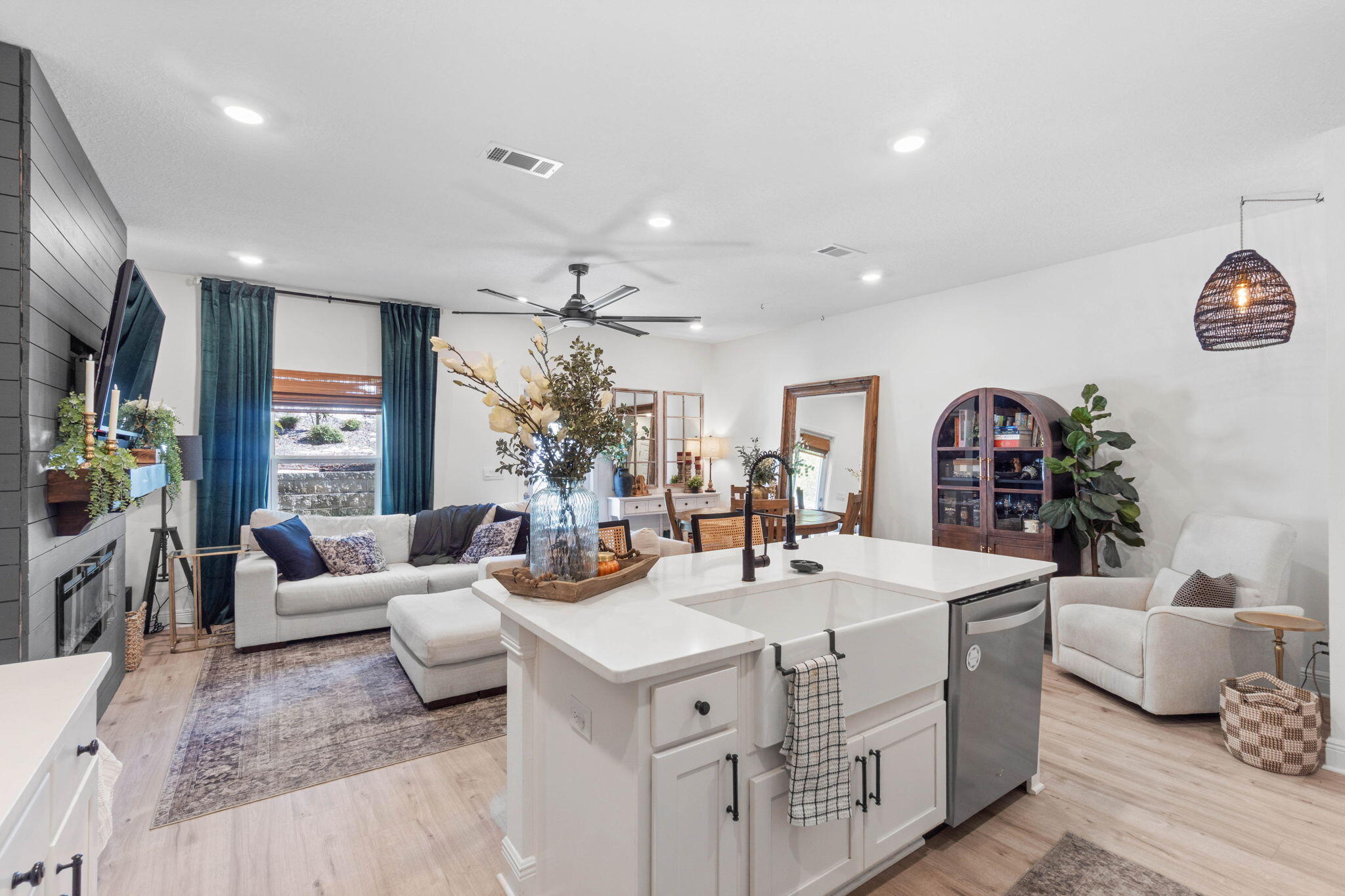 Experience coastal living at its finest in this exceptional 3-bedroom townhome.
 While many nearby towns boast about proximity to Destin beaches, locals know the real secret: being right in West Destin puts you in the heart of everything that makes this area so special. Under a mile from coffee shops, dining, playgrounds, HarborWalk Village, and local breweries...you're minutes from a handcrafted latte, sunsets by the harbor, or good times with friends.The main level of the home serves as your entertainment hub, with an open layout, well-appointed kitchen, half bath, and seamless access to a covered back porch. Upstairs, your peaceful retreat awaits. All bedrooms are thoughtfully separated from the main living spaces. The primary bedroom features a spa-inspired ensuite with gorgeous tiled walk-in shower, double vanities, and generous closet space. Two additional bedrooms and a third full bathroom complete the second floor. Durable luxury vinyl plank flooring throughout means no carpet maintenance.
The sellers have enhanced this 2023-built home with thoughtful upgrades, including:
- A custom fireplace feature wall with shiplap paneling, hearth, electric fireplace, and universal TV mount
- Updated half bath with new molding and paint
- New lighted ceiling fans throughout
- Upgraded kitchen sink and faucet with built-in bottle and glass cleaner
- DEAKO light switch dimmers
- Enhanced front yard landscaping with gutter downspout piping, gravel, and mulch
Unlike most units in Harbor Place, 32 Redbird offers a double driveway, plus ample guest parking.
Located in Flood Zone X, no flood insurance is required by the lender.
This is simply the finest home available in Destin in the $400,000 range; newer construction, premium finishes, unbeatable location, and practical features.
Don't just visit Destin. Live here!