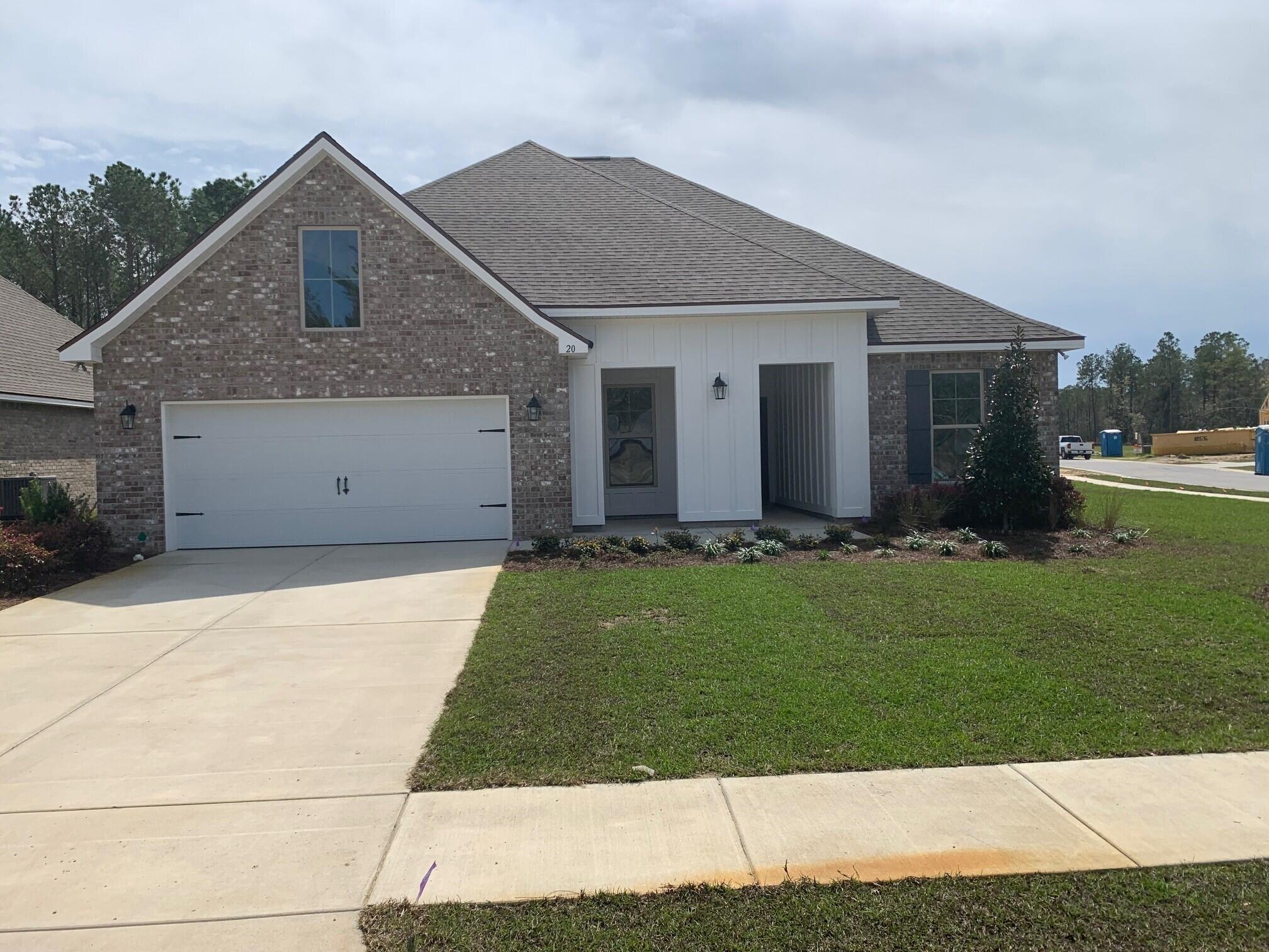 Located on a corner lot, the HICKORY III G in Starburst at Hammock Bay community offers a 5 bedroom, 3 full bathroom, open design. Upgrades added (list attached). Features: double vanity, garden tub, separate custom tiled shower with frameless door, and walk-in closet in the master suite, double vanity in bathrooms 2 and 3, formal dining room, den, boot bench at garage entry, kitchen island, walk-in pantry, recessed lighting, crown molding, framed mirrors in all bathrooms, smart connect Wi-Fi thermostat, smoke/carbon monoxide detectors, landscaping package, architectural 30-year shingles, flood lights, and more!Energy Efficient Features: water heater, kitchen appliance package, vinyl low E windows, and more!