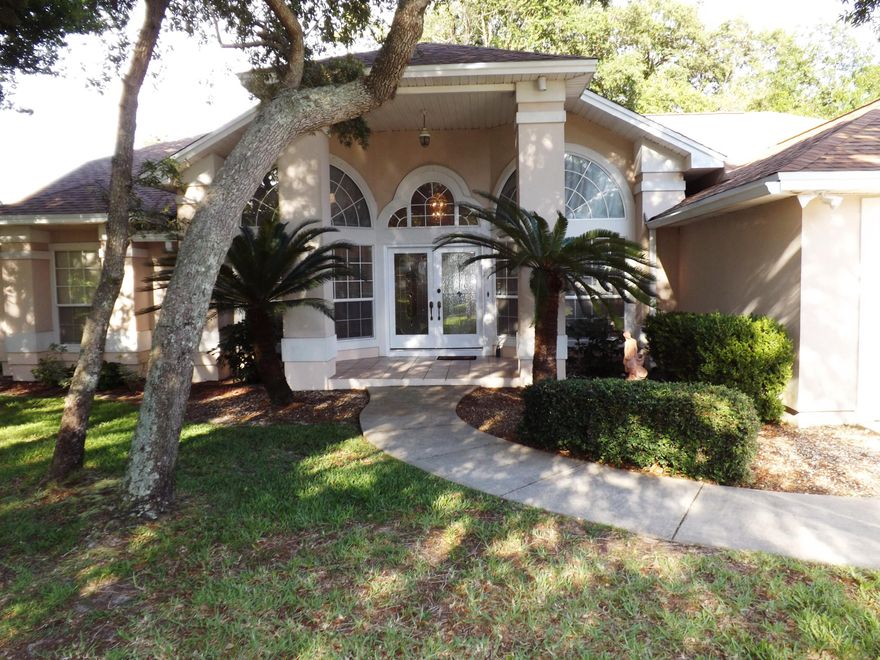 Beautiful golf course home surrounded by mature trees in sought after Lake Lorraine subdivision. Vaulted ceilings and open spaces make this home feel much larger than it's 2150sf. Family room with fireplace has 3 large sliding doors that open to enclosed porch and overlooks golf course. Formal living room and dining area give you extra space to eat and relax. Main bedroom also has sliding door to porch. Main bath features double vanities, separate shower, jetted tub and large walk-in closet. Tall trees shade front and backyard and home sits by tee box so you won't be bothered with stray golf balls!! New roof 2018. SELLER MOTIVATED! Buyer to verify all measurements.