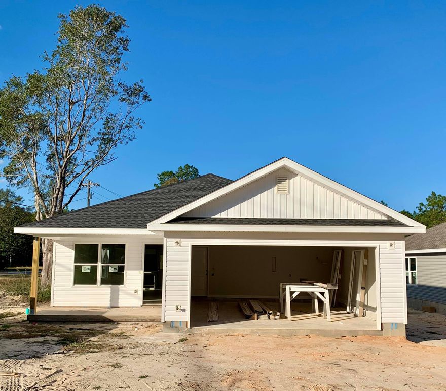 Affordable new construction built by Award-winning Parade of Homes builder and situated on a level, corner lot in the Garden City community located in North Crestview. The home features low maintenance vinyl siding w/ a 2 car garage and cozy front porch. The home boasts an open floor plan w/ spacious living/dining area adjacent to the beautiful, bright kitchen. All white cabinetry, stunning quartz countertops, stainless steel appliances and counter height bar. Nice master suite w/ dual closets and bathroom vanities, shower only and nice cabinetry w/ linen tower for storage. Additional bedrooms are a nice size as well. Covered rear patio for relaxing and entertaining your guests! Front exterior will be finished out w/ window shutters. Estimated date of completion is mid January.