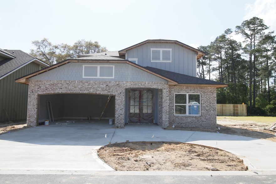 Welcome to Vieux Carre', a premier new 12 lot development featuring Craftsman style homes with a Louisiana flair. Homes will feature slurried brick, hardy board siding, copper lanterns, etc. As you enter the front of this 4/4 home, through the large covered porch with 8 Ft. solid wood stained front door, the dining room is on your right, and the staircase to be rustic wood stained stairwell is in front of you. Continuing forward, a powder room is on the left, and the gourmet kitchen is on the right. Kitchen will boast custom cabinetry with crown moulding, 3 CM. granite countertops, Frigidaire Gallery series stainless appliances (including a commercial grade refrigerator/ freezer), and roomy breakfast bar.
