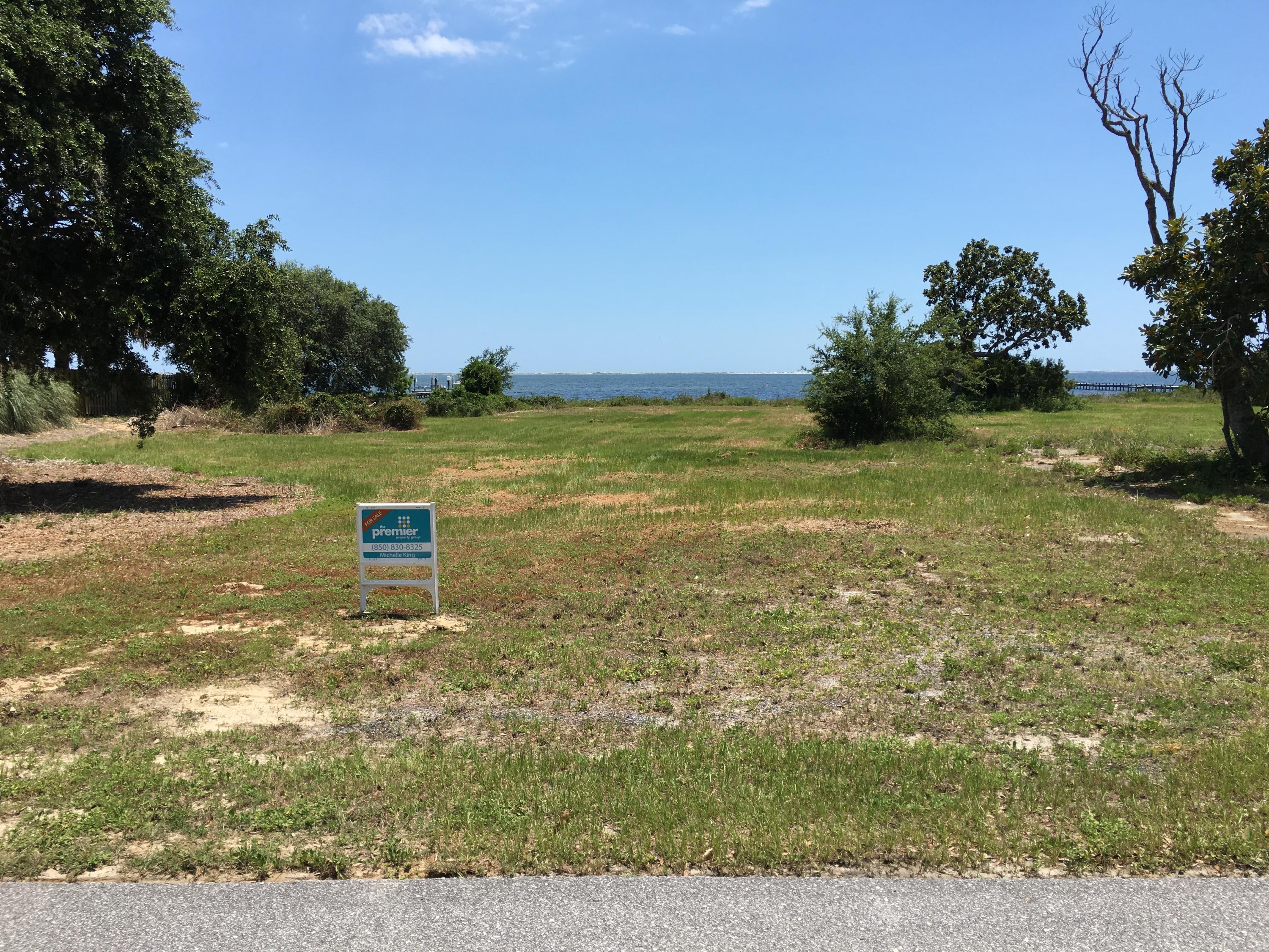 Nearly 100 feet on the water! This half an acre lot is located in a private waterfront community. Community is centrally located to beaches, military bases, restaurants and shopping. Check out community amenities! Dimensions of lot to be verified by the buyer.